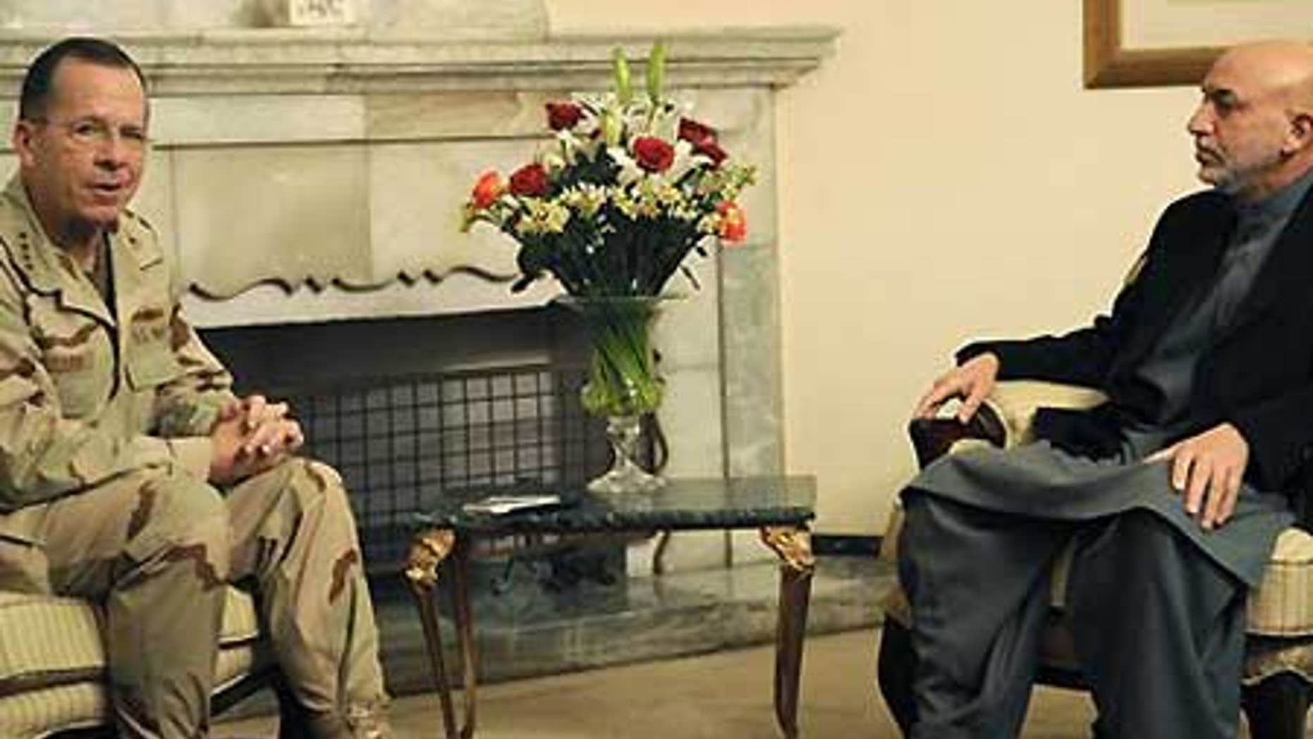 Dec. 17: Afghan President Hamid Karzai listens as Adm. Mike Mullen speaks during a meeting at the Presidential Palace in Kabul.
