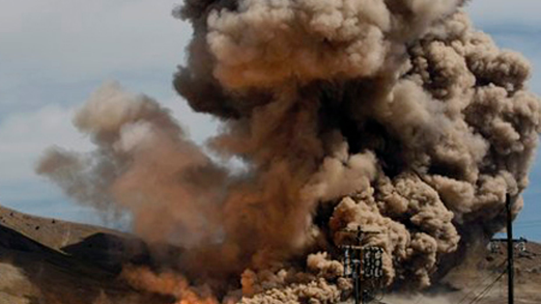 The plume of smoke and dust from the five-segment, first stage of the Ares-1 rocket fills the area during a test at ATK Space Systems, Thursday, September 10, 2009 in Promontory, Utah. The motor is NASA's next generation transportation system designed for the Orion program. (AP Photo/Colin Braley