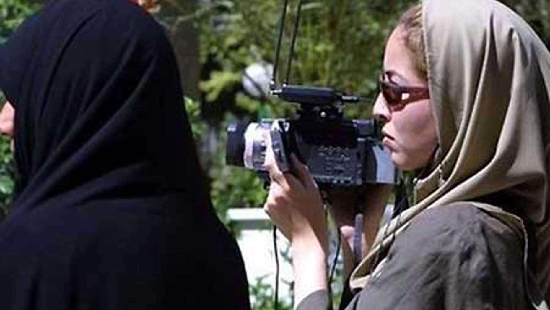 File: U.S. journalist Roxana Saberi filming in Tehran.