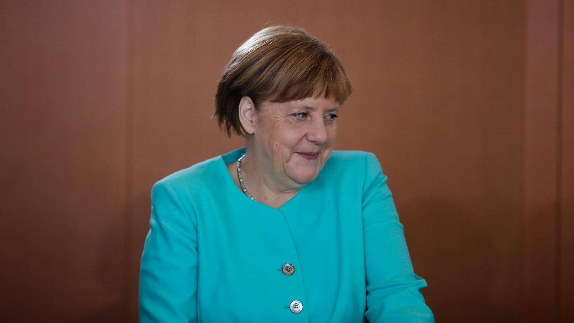 German Chancellor Angela Merkel arrives for the cabinet meeting of the German government at the chancellery in Berlin, Wednesday, June 8, 2016. (AP Photo/Markus Schreiber)
