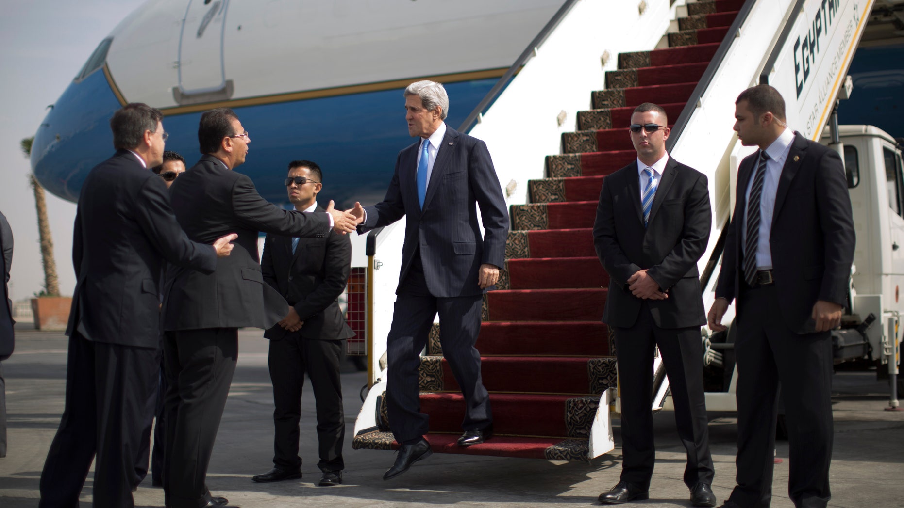 U.S. Secretary of State John Kerry arrives in Cairo, Sunday, Nov. 3, 2013. Kerry is in Cairo pressing for reforms during the highest-level American visit to Egypt since the ouster of the country's first democratically elected president. The Egyptian military's removal of Mohammed Morsi in July led the U.S. to suspend hundreds of millions of dollars in aid. This is the first stop in an 11-day trip that will take Kerry to the Mideast and Europe. (AP Photo/Jason Reed, Pool)