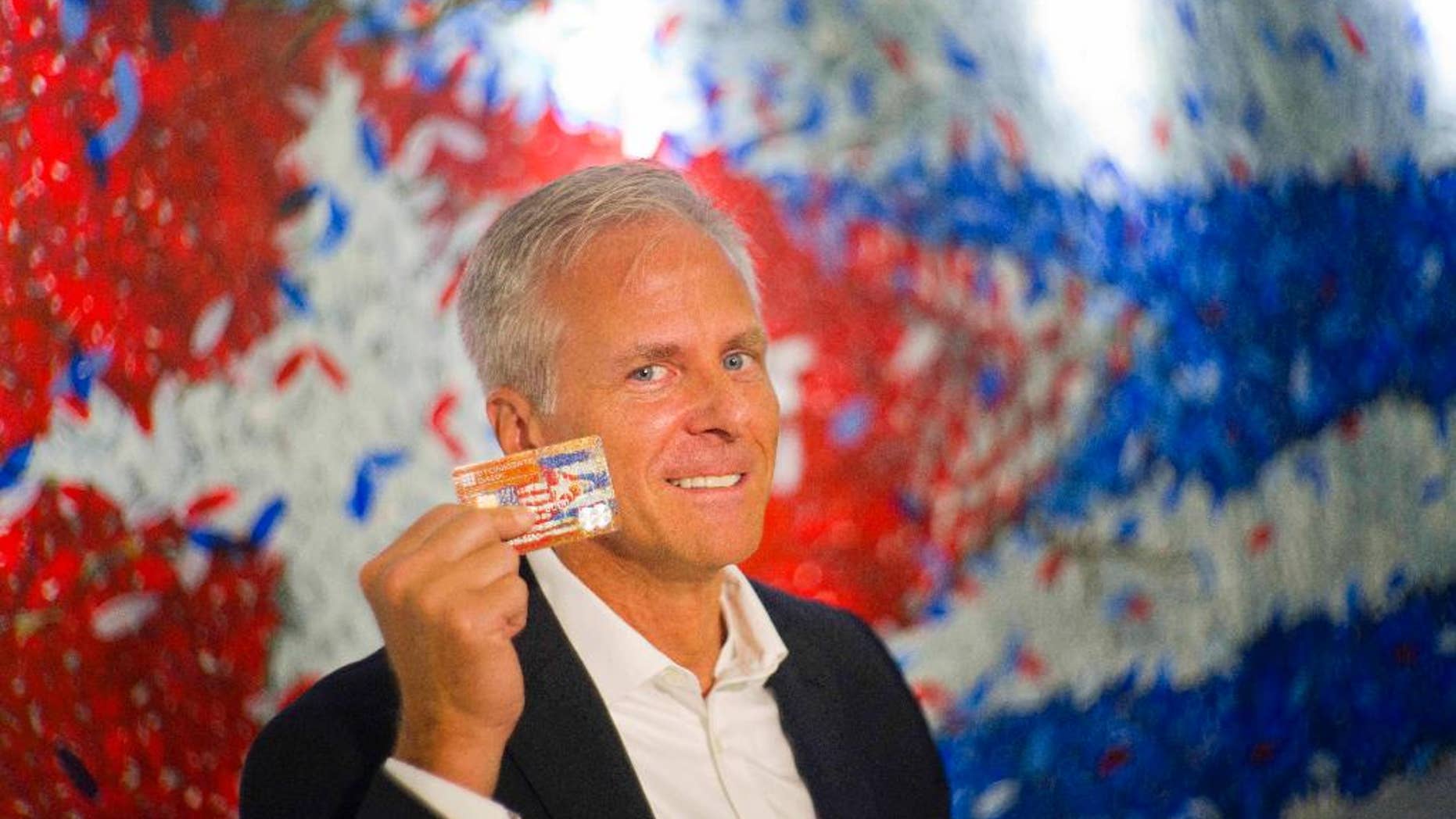 In this June 8, 2016 photo, Stonegate Bank President David Seleski poses with a credit card during an interview in Havana, Cuba. Stonegate, a small Florida bank, will issue the first U.S. credit card designed to work in Cuba on Wednesday, June 15, making it easier for American companies to do business on an island largely cut off from the U.S. financial system. (AP Photo/Ramon Espinosa)