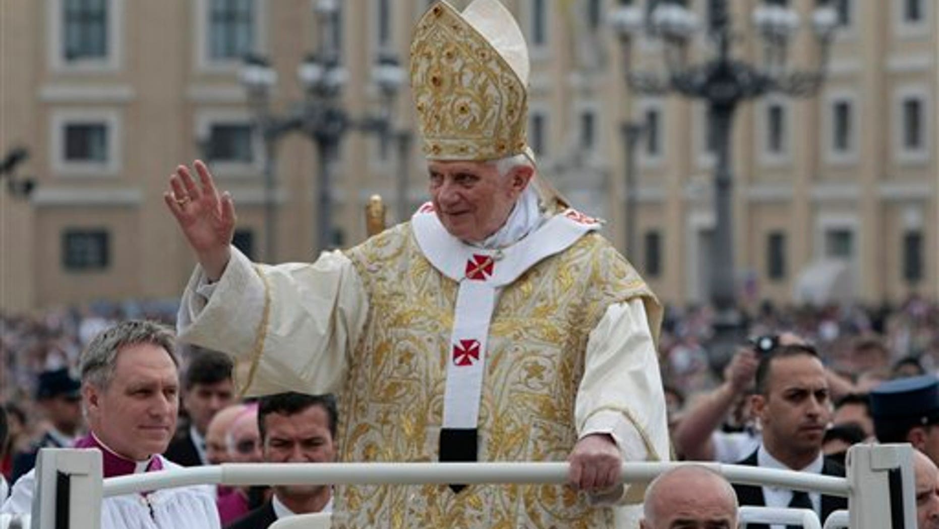 April 24: Pope Benedict XVI blesses the faithful upon his arrival in St. Peter's square to celebrate Easter mass at the Vatican. (AP)