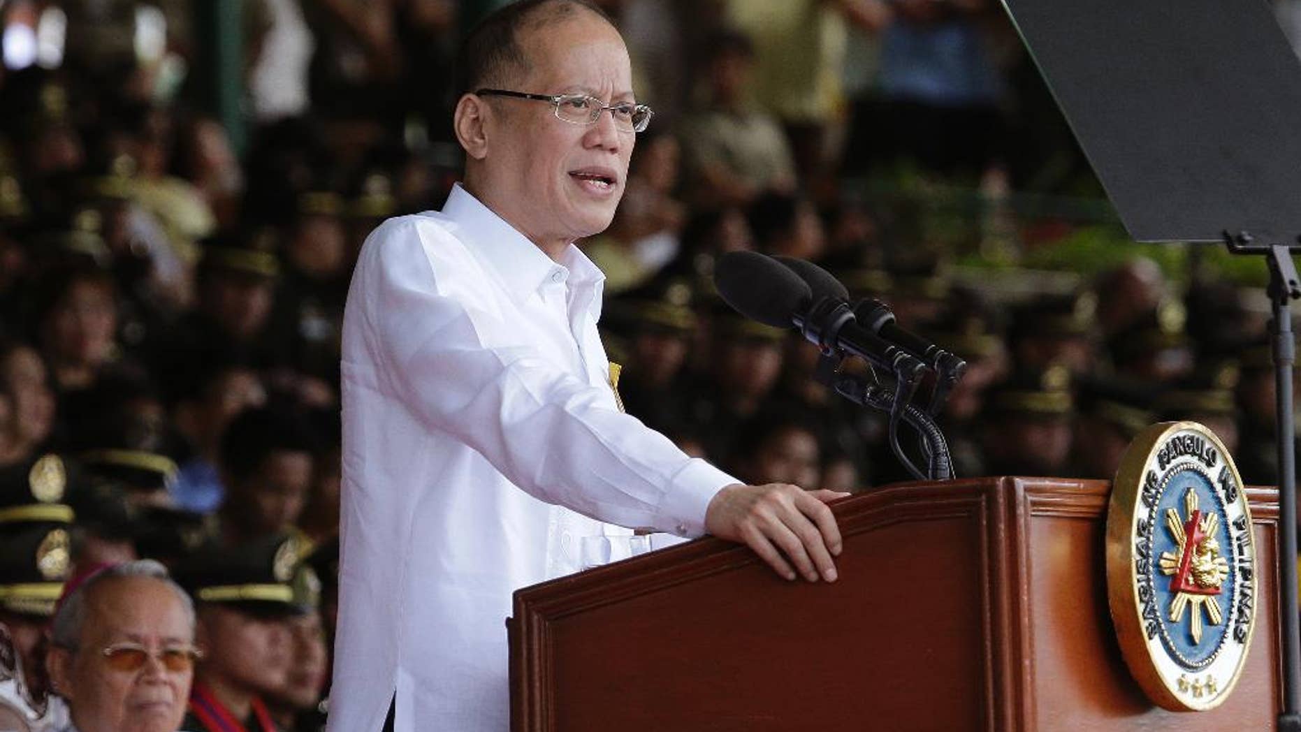 FILE - In this file photo from March 22, 2016, Philippine President Benigno Aquino III delivers a speech south of Manila, Philippines, on Tuesday, March 22, 2016. Aquino has called this week's election a referendum on his "straight path" style of reformist governance, but his candidate Sen. Ferdinand "Bongbong" Marcos Jr. has lost by millions of votes to a shoot-from-the-lip mayor. (AP Photo/Aaron Favila, File)