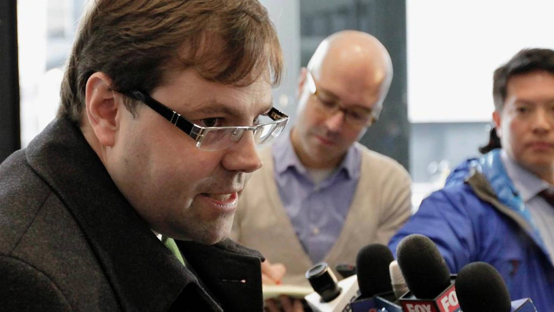 FILE - In this Dec. 21, 2012 file photo, attorney Beau Brindley speaks with reporters at the federal building in Chicago. A federal judge acquitted Brindley Monday Aug. 31, 2015, at a rare trial of a lawyer on multiple counts of perjury and obstruction-of-justice charges for allegedly coaching clients and witnesses to lie. (AP Photo/Teresa Crawford, File)