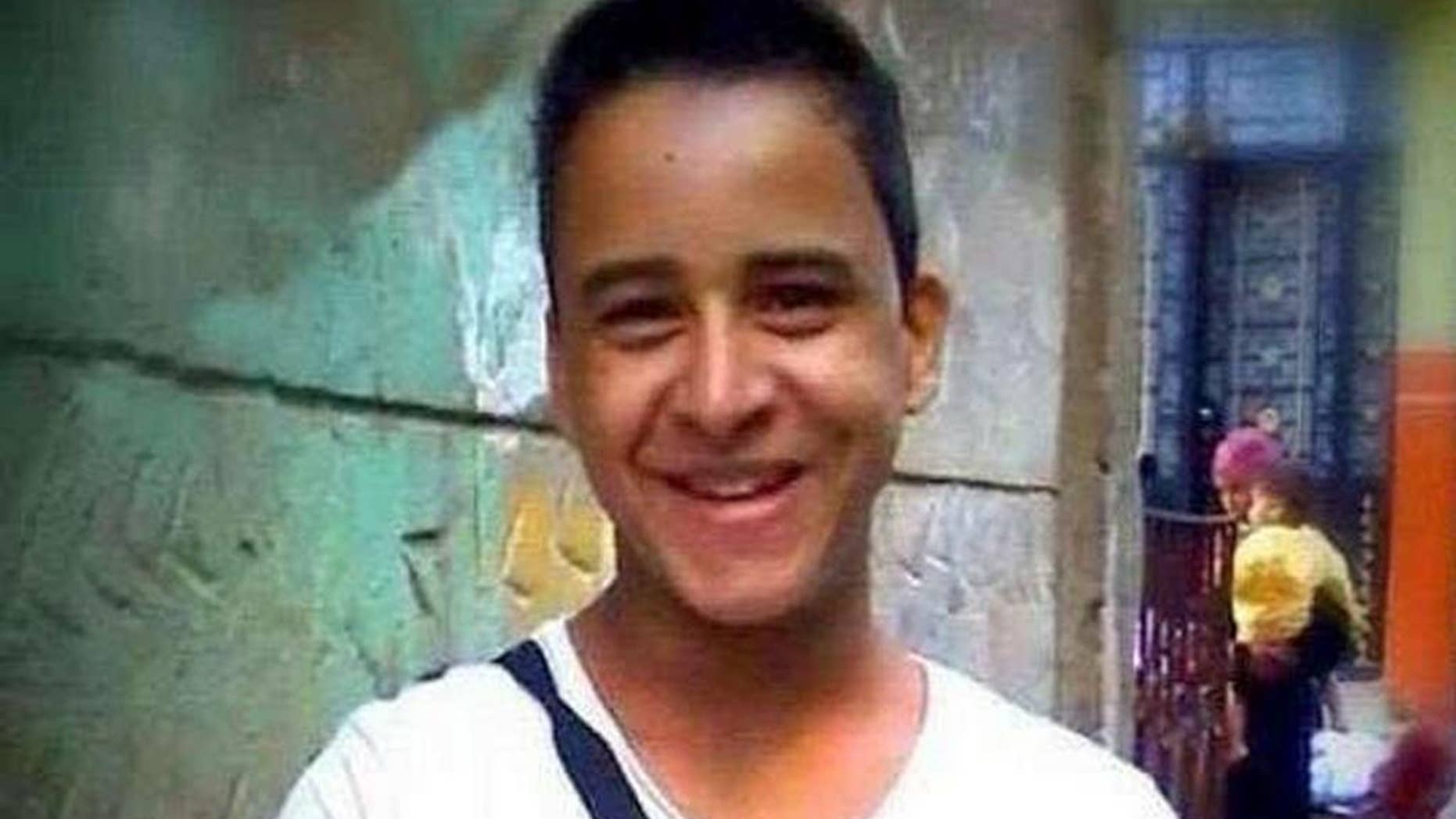 This undated photo provided by the family of Mahmoud Mohammed Ahmed, shows Mahmoud Mohammed Ahmed in Cairo, Egypt prior to his arrest in Jan 2014 while wearing a T-shirt that bore the slogan "A nation without torture." An Egyptian court on Thursday, March 24, 2016 ordered the release of Ahmed, who was accused by police of taking part in unauthorized demonstrations, possession of explosives and paying money to others to take part in street protests, his brother and lawyer told The Associated Press. He was never formally charged during his two years in detention. (Family of Mahmoud Mohammed Ahmed via AP)