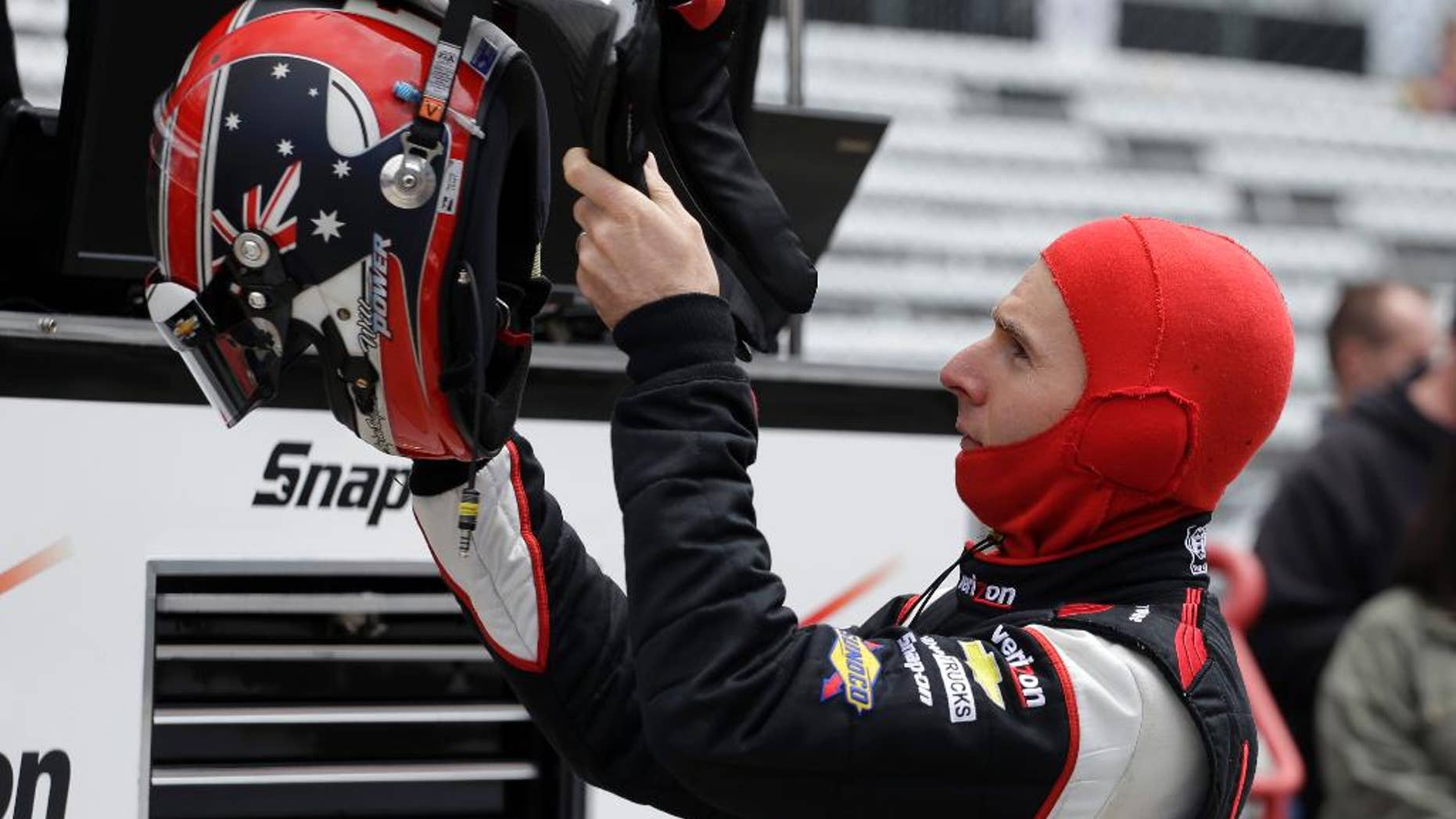 Driver Will Power, of Australia, prepares to drive during practice for Indianapolis 500 IndyCar auto race at the Indianapolis Motor Speedway in Indianapolis, Friday, May 16, 2014. (AP Photo/Darron Cummings)