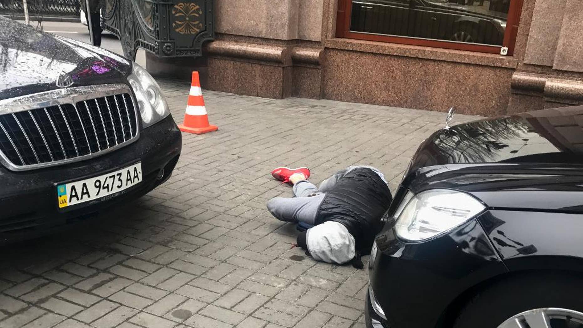 March 23: An assassin, who shot and killed Denis Voronenkov, lies wounded in Kiev, Ukraine.