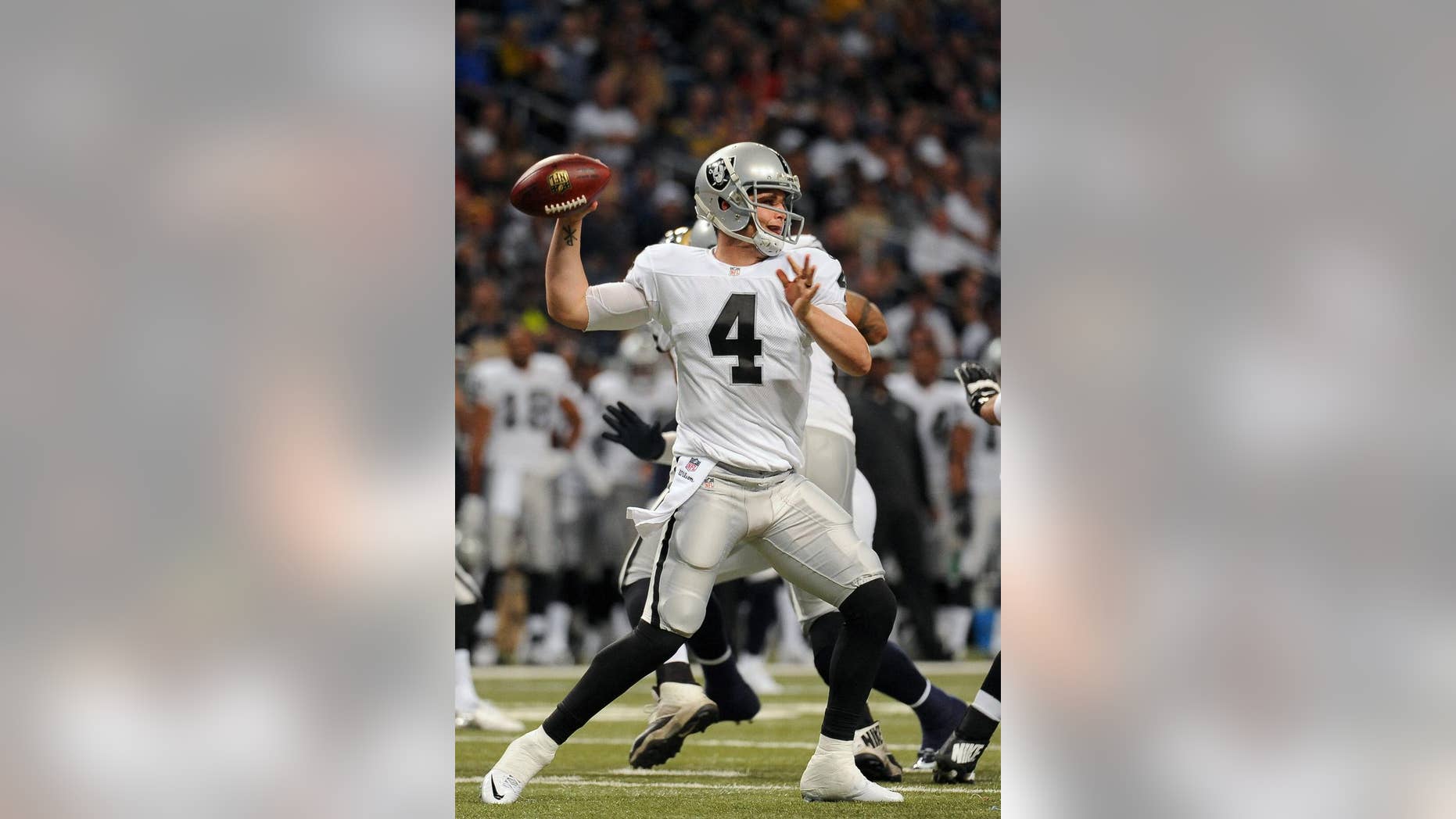 Oakland Raiders quarterback Derek Carr throws during the first quarter of an NFL football game against the St. Louis Rams, Sunday, Nov. 30, 2014, in St. Louis. (AP Photo/L.G. Patterson)