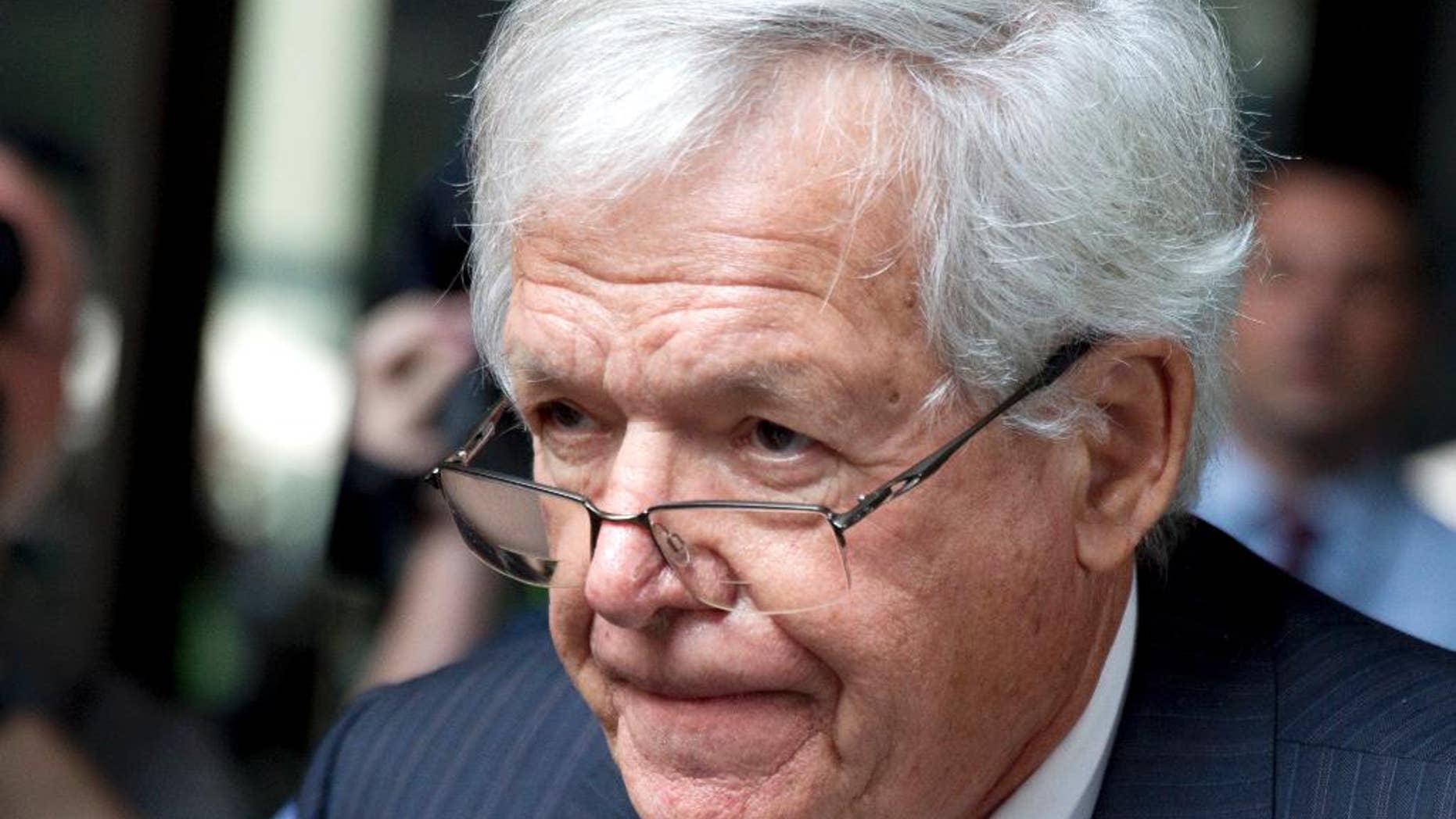 FILE - In this June 9, 2015 file photo, former House Speaker Dennis Hastert departs the federal courthouse in Chicago after his arraignment on federal charges that he broke federal banking laws and lied about the money when questioned by the FBI. On Tuesday, July 14, 2015, a pre-trial status hearing is scheduled for Hastert in his federal hush-money case. (AP Photo/Christian K. Lee)