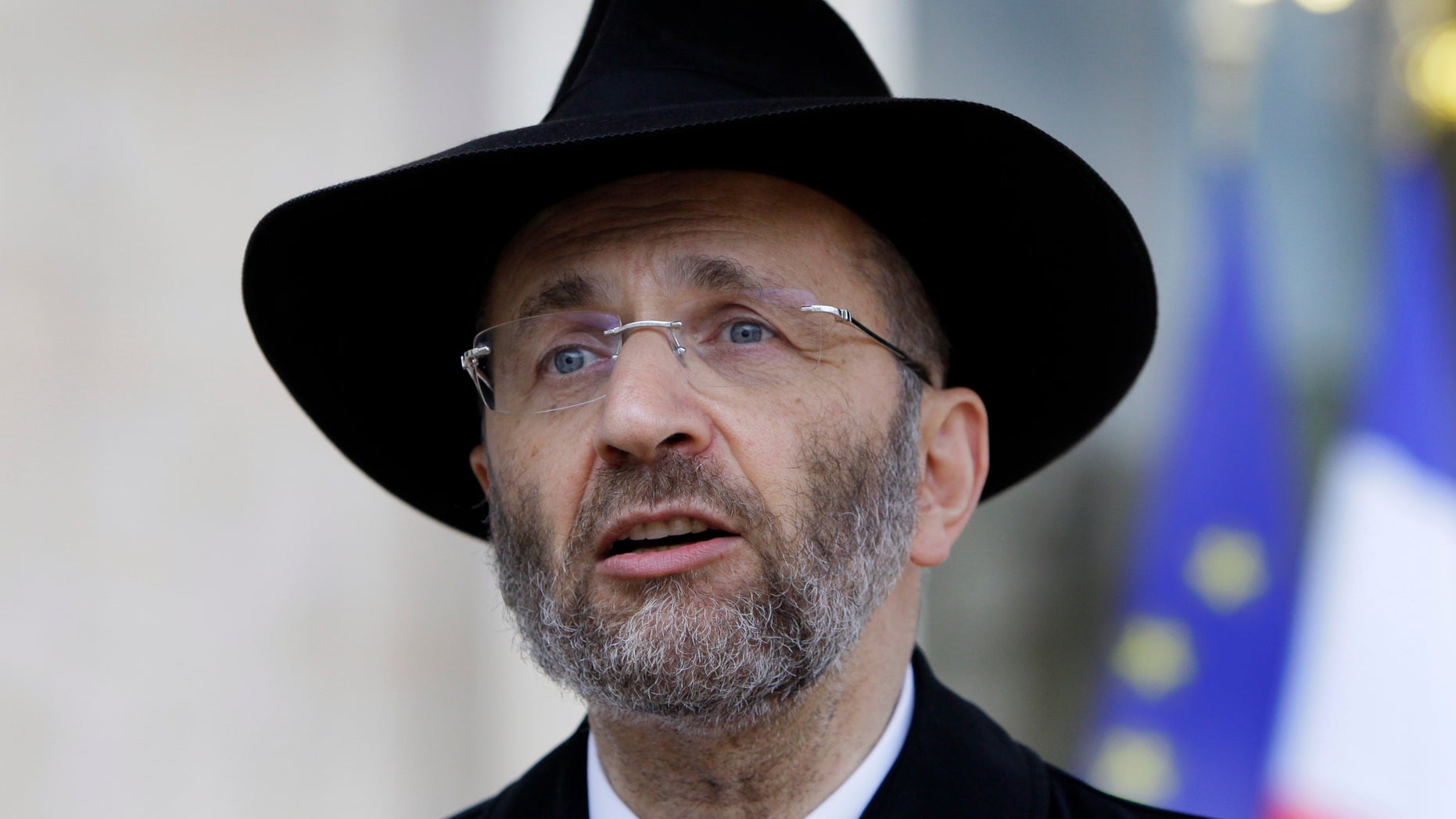 FILE - In this July 12, 2012 file photo, France's Grand Rabbi Gilles Bernheim talks to the media after his meeting with French President Francois Hollande at the Elysee Palace in Paris. French Jewish leaders were holding an urgent meeting to discuss the career fate of France’s chief rabbi Bernheim after he acknowledged “mistakes” amid allegations that he plagiarized texts and lied about his educational background.(AP Photo/Francois Mori, File)