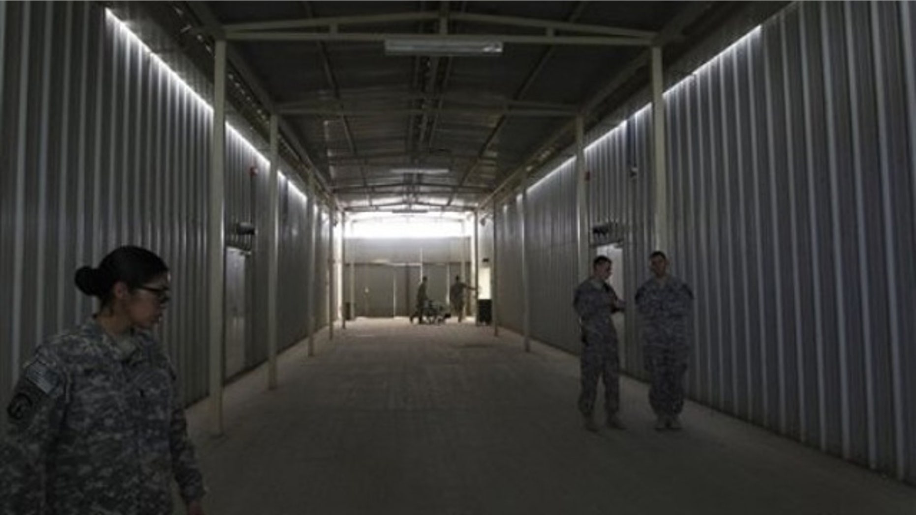 Aug. 27: U.S. soldiers stand outside cells at a newly built U.S.-run Parwan Detention Facility in Bagram north of Kabul, Afghanistan.