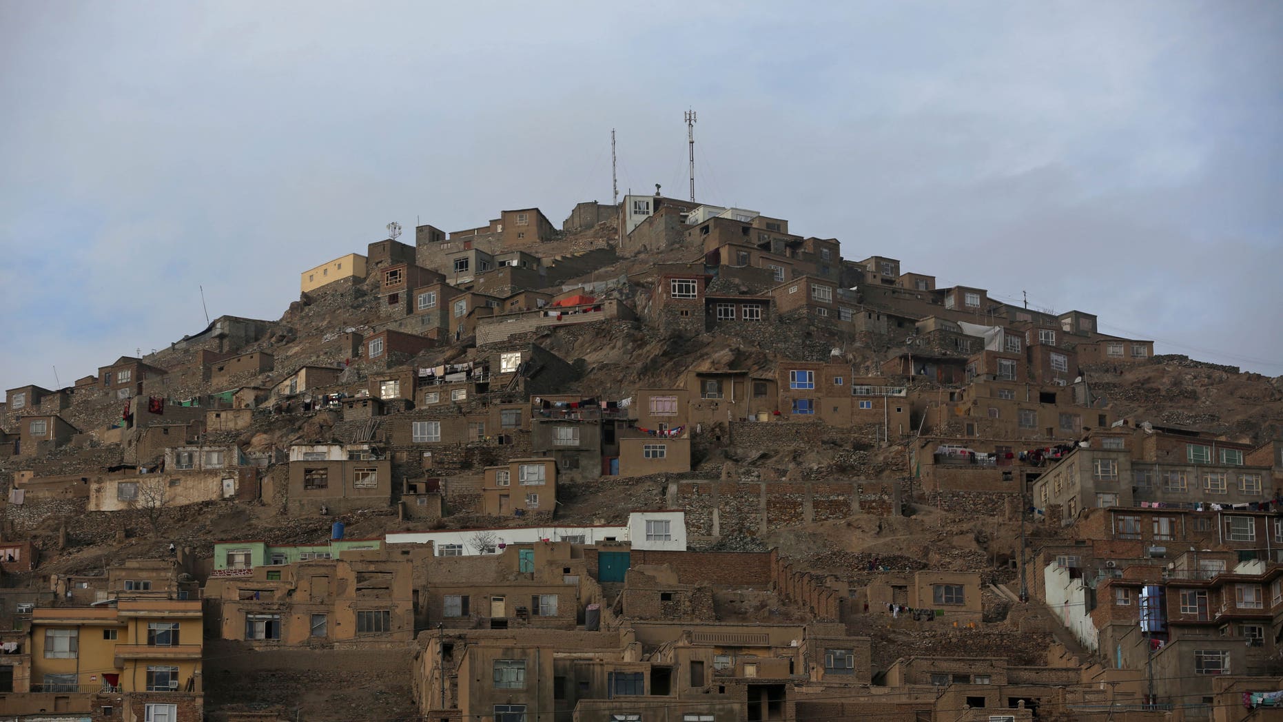 Mud made houses are build on a hill in a staircase pattern in Kabul, Afghanistan, Wednesday, Jan. 29, 2014. The war-torn country still faces the challenges of poverty, unemployment and a lack of infrastructure. (AP Photo/Massoud Hossaini)