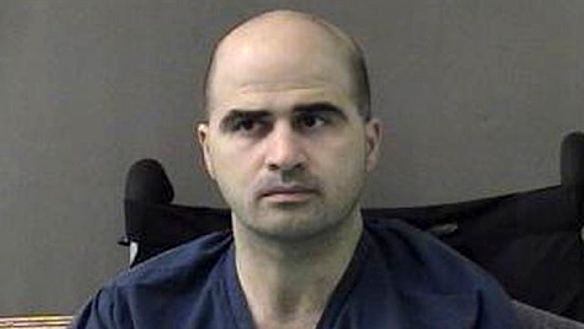 April 9, 2010: In a photo released by the Bell County Sheriffs Department, U.S. Major Nidal Hasan sits at the San Antonio to Bell County Jail in Belton, Texas.