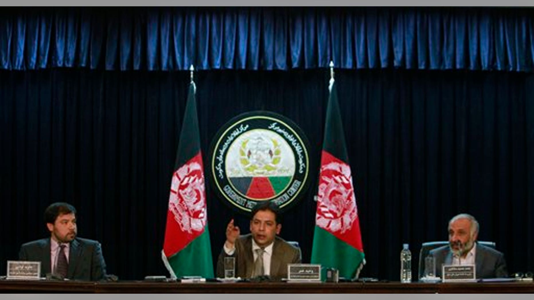 June 12: Afghan presidential spokesman Waheed Omar, center, speaks as Afghan Deputy Foreign Minister Jawid Luddin, left, and Masoom Stanekzai, right, secretary of a peace council set up by President Hamid Karzai listen during a press conference in Kabul, Afghanistan.