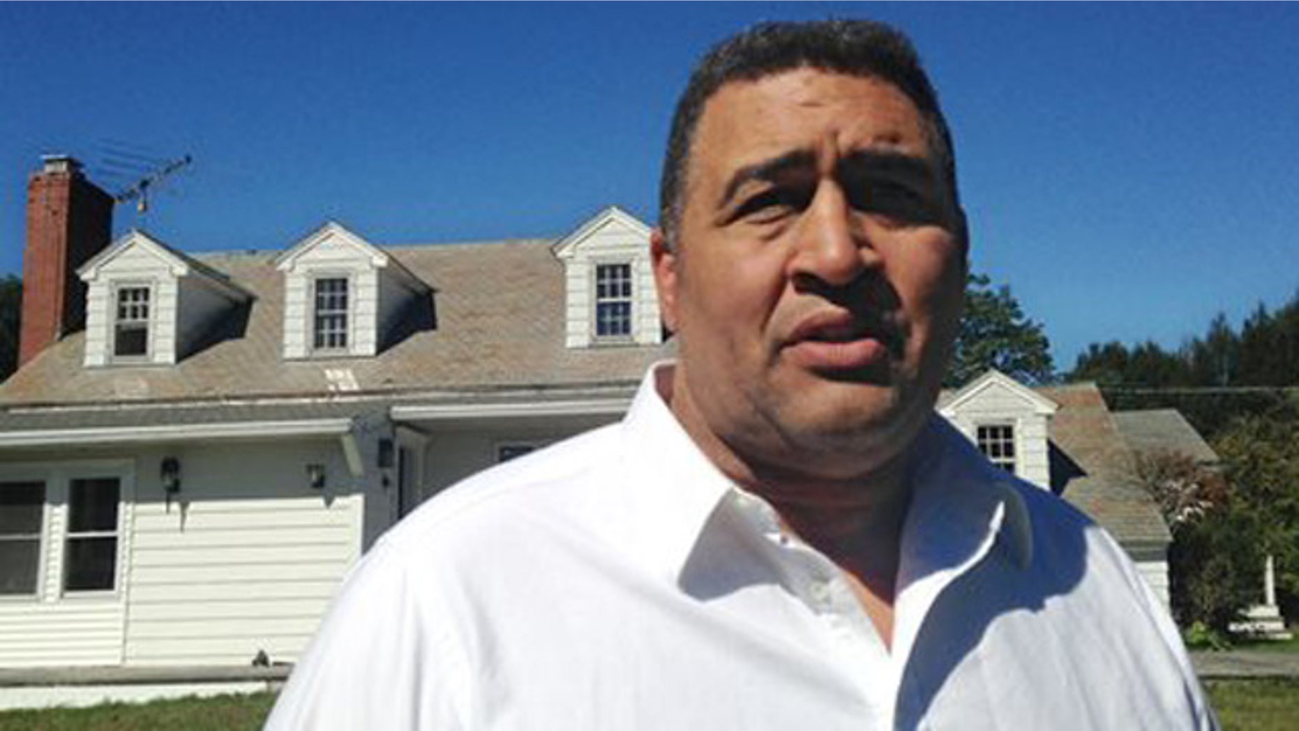 Sept. 18, 2013: Former NFL offensive lineman Brian Holloway stands in front of his rural vacation home.