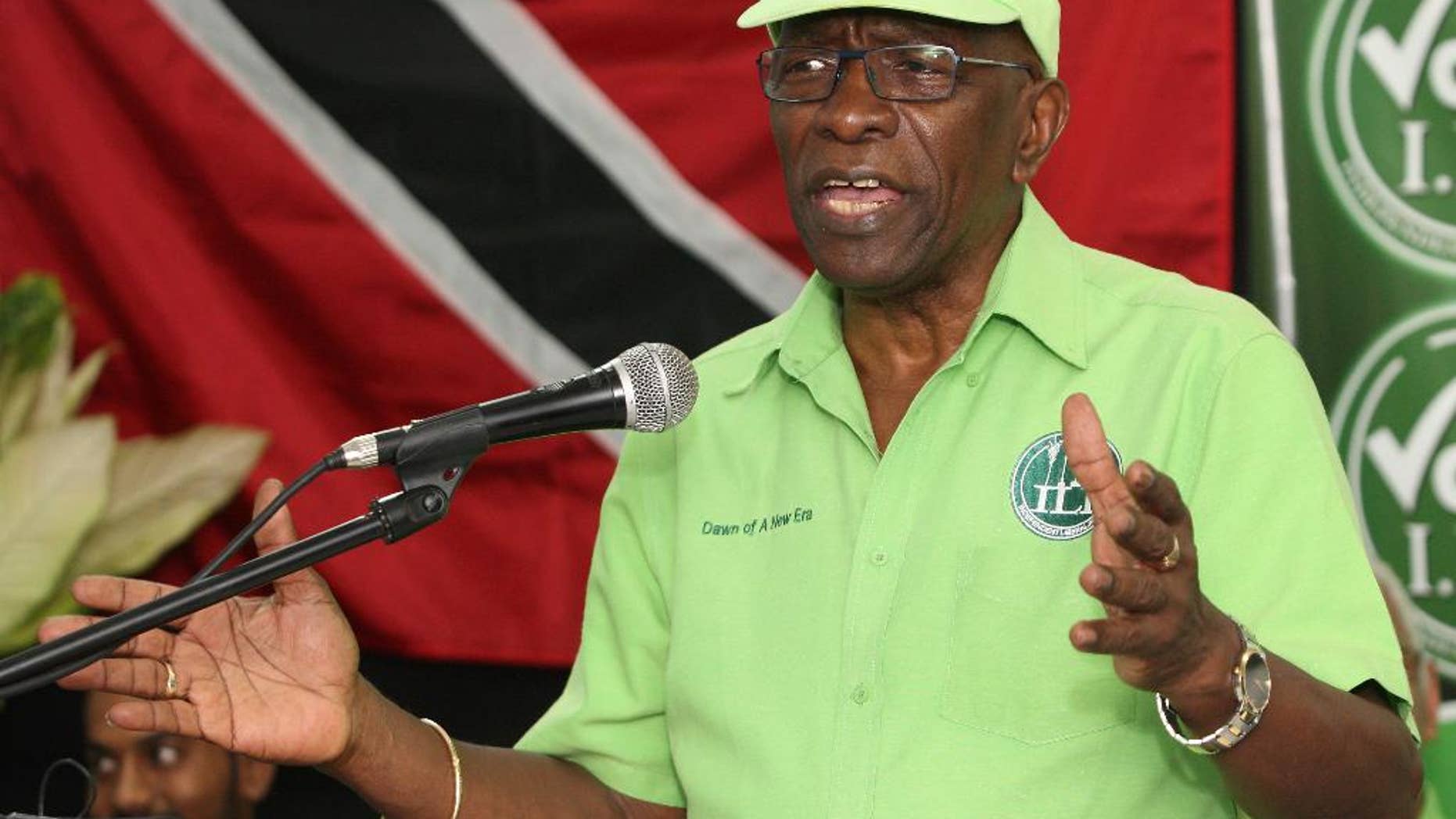 FILE - In this June 3, 2015 file photo, former FIFA vice president Jack Warner speaks at a political rally in Marabella, Trinidad and Tobago. Warner, a former member of Parliament in his homeland, said Wednesday, June 10, 2015, that he intends to resist extradition at a hearing scheduled for July 9. He faces charges that include racketeering and money-laundering. Authorities earlier confiscated his passport, fearing he might flee. (AP Photo/Anthony Harris, File)