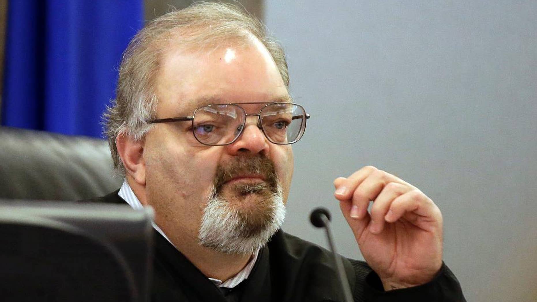 FILE - In this Feb. 23, 2015, file photo, Conrad Hafen presides over a hearing in Las Vegas. The former judge, who lost a re-election bid, has been barred for life from the court bench in Nevada as punishment for ordering a defense attorney handcuffed when she wouldn't stop arguing to keep a client out of jail, and then sentencing her client to jail for petty theft. (AP Photo/Isaac Brekken, File)