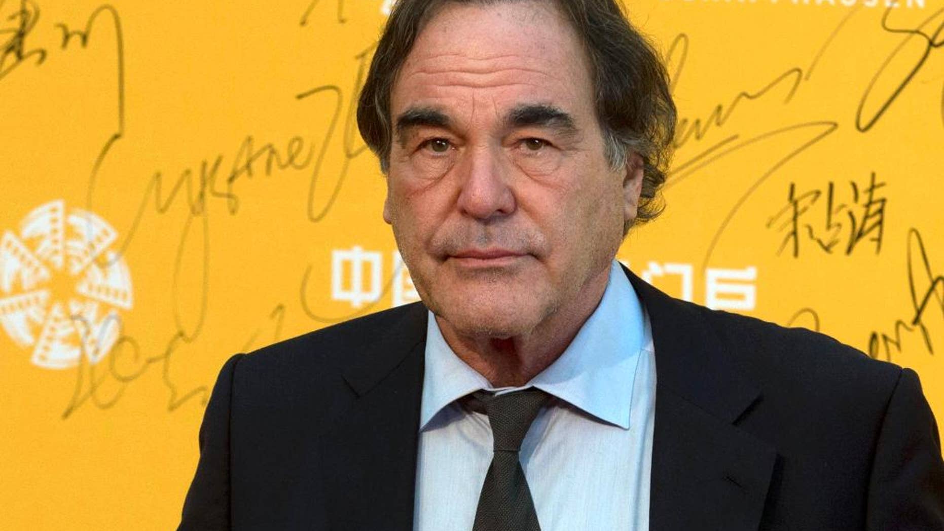 FILE - This April 16, 2014 file photo shows director Oliver Stone at the 4th Beijing International Film Festival held in Beijing, China. On Saturday, May 7, 2016, Stone told University of Connecticut graduates of his academic failures that led him to drop out of school for a while before starting fresh at a new university and ultimately launching a successful film career, during a graduate school commencement address at UConn's main campus in Storrs, Conn. (AP Photo/Ng Han Guan, File)