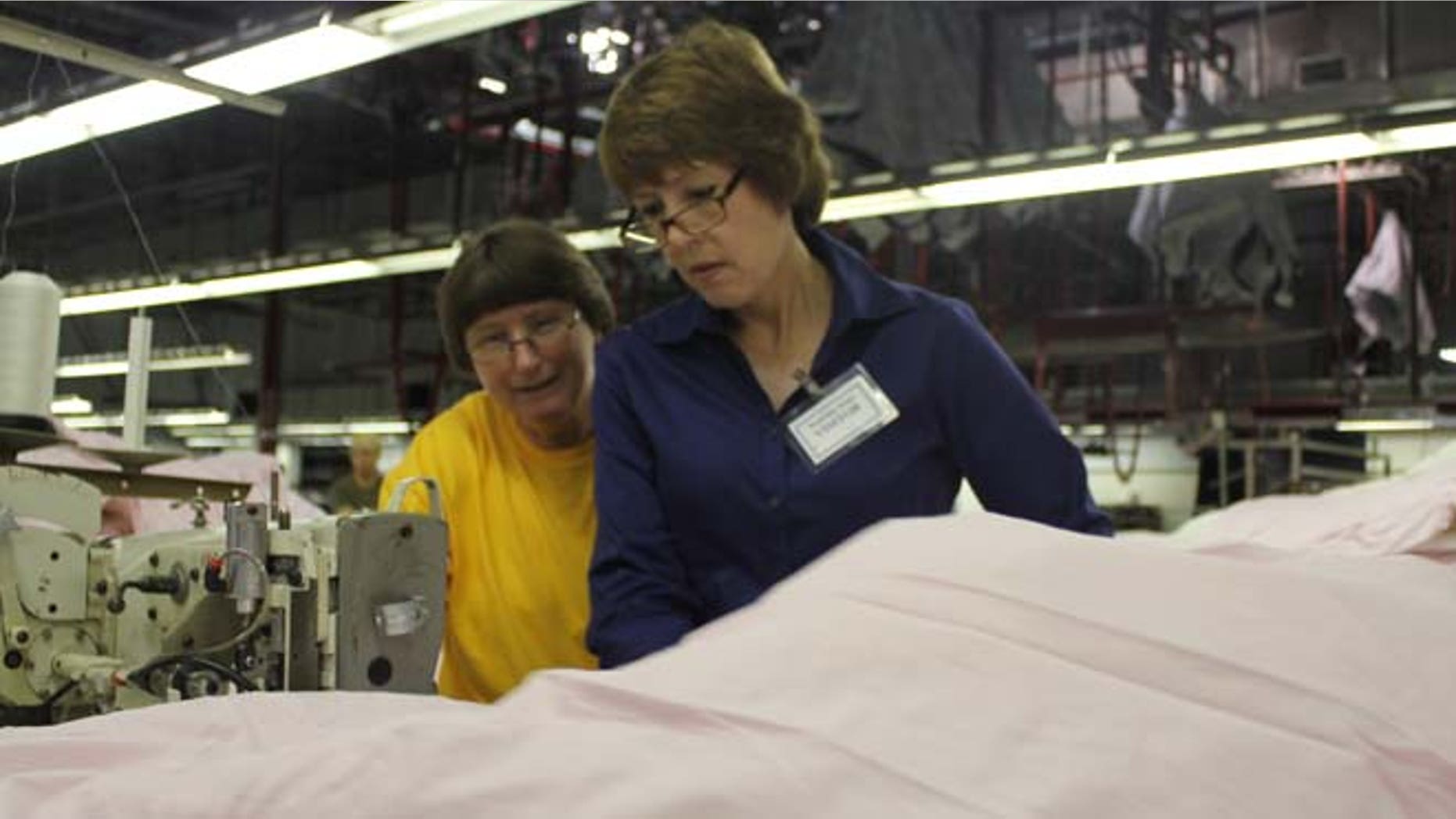 Rep. Gwen Graham, D-Fla., works on the factory floor during a "workday."
