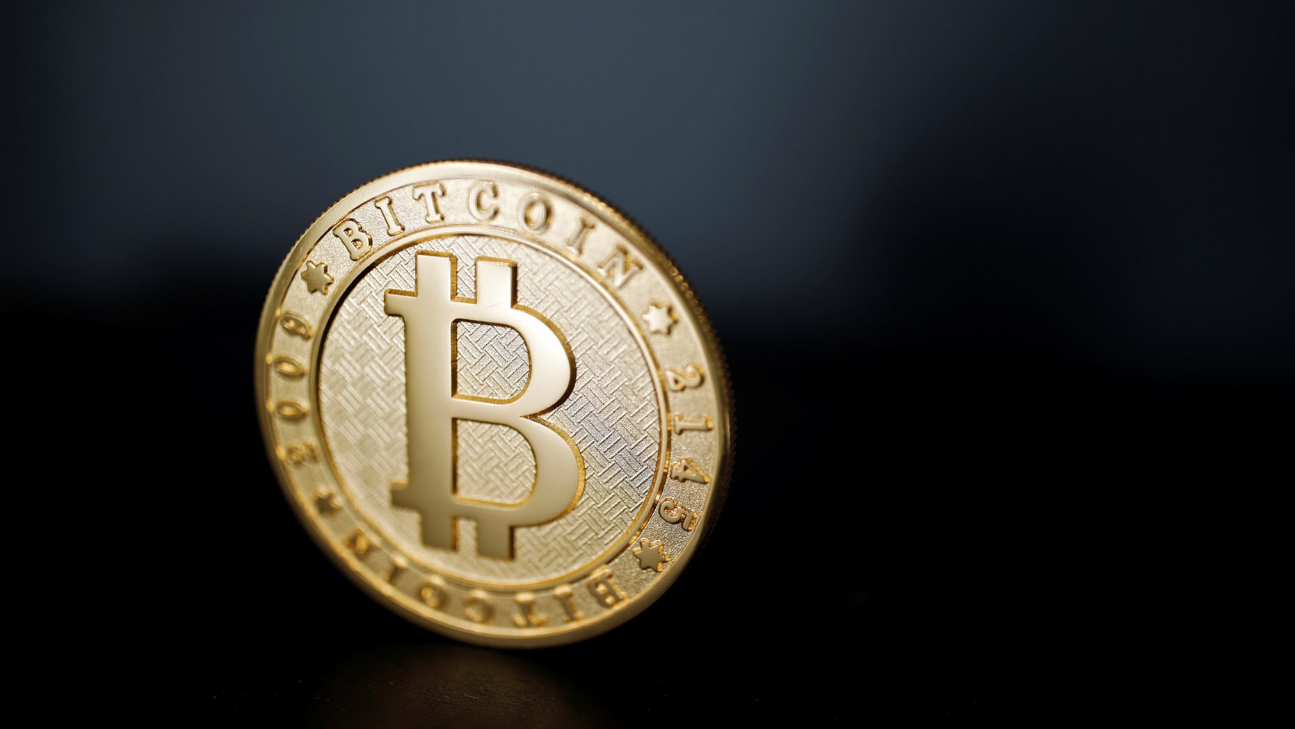 A Bitcoin is seen in a picture taken at La Maison du Bitcoin in Paris.