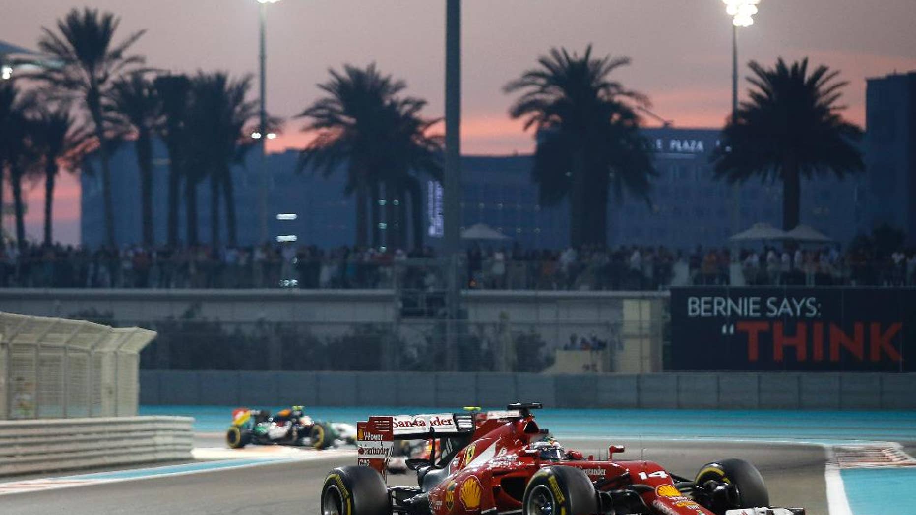 Ferrari driver Fernando Alonso of Spain races during the Emirates Formula One Grand Prix at the Yas Marina racetrack in Abu Dhabi, United Arab Emirates, Sunday, Nov. 23, 2014. (AP Photo/Luca Bruno)