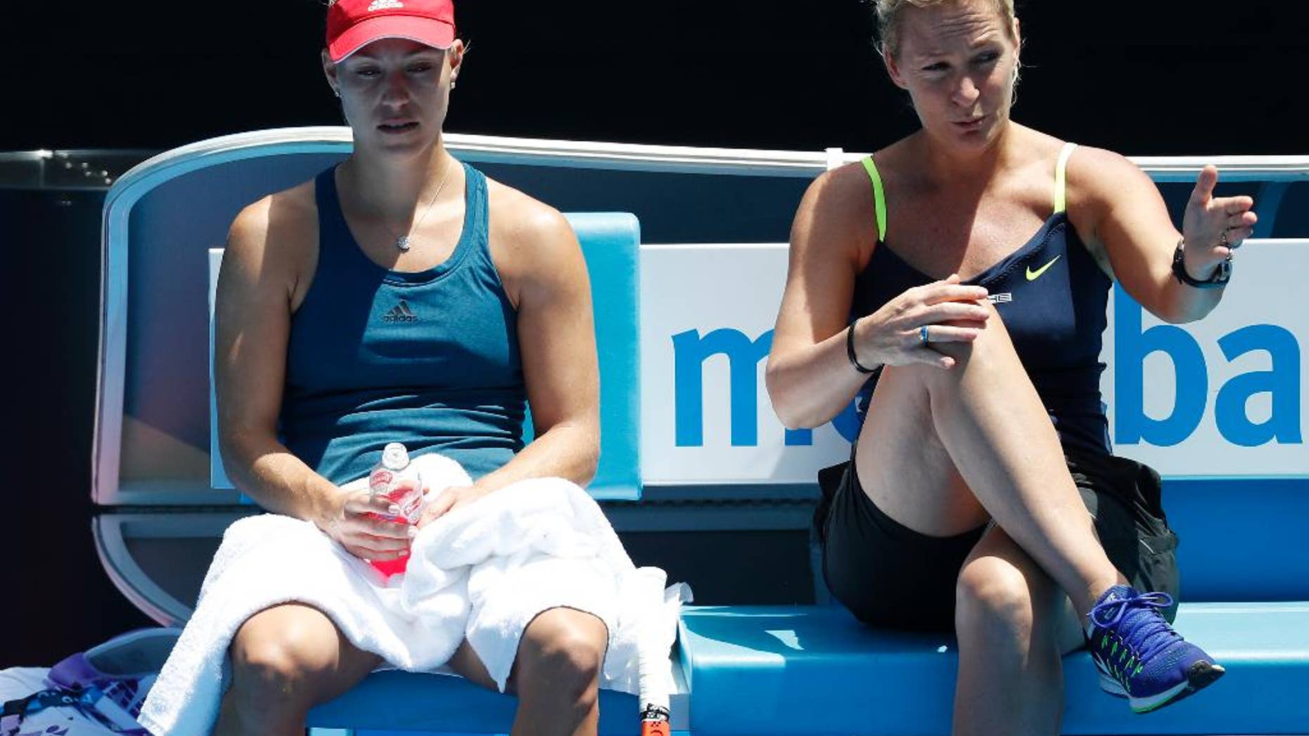 Germany's Angelique Kerber, left, listens to her coach Barbara Rittner during a practice session ahead of the Australian Open tennis championships in Melbourne, Australia, Sunday, Jan. 15, 2017. (AP Photo/Kin Cheung )