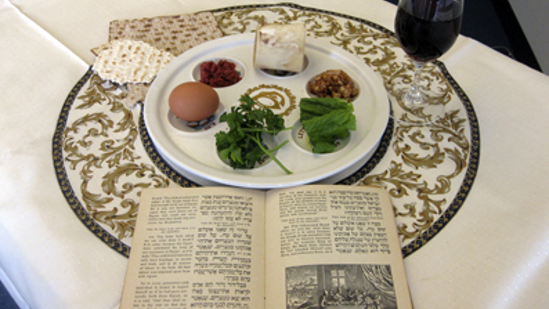 FILE: March 15, 2011: A 1936 Maxwell House Haggadah alongside a Seder plate in New York.