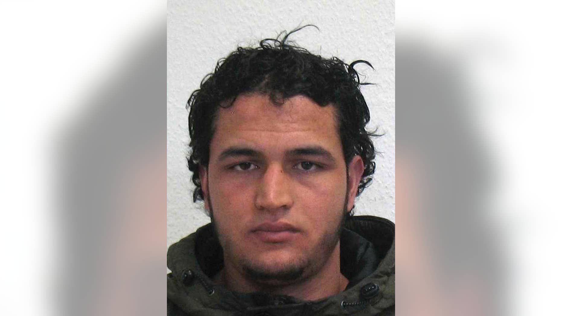 The wanted photo issued by German federal police on Wednesday, Dec. 21, 2016 shows 24-year-old Tunisian Anis Amri. Swiss authorities said Wednesday, Jan. 18, 2017 the gun used by Berlin attacker Anis Amri was imported to Switzerland in the early 1990s. Investigators are still trying to figure out how Amri got hold of the .22-caliber handgun made by now-defunct German manufacturer Erma. (German police via AP)