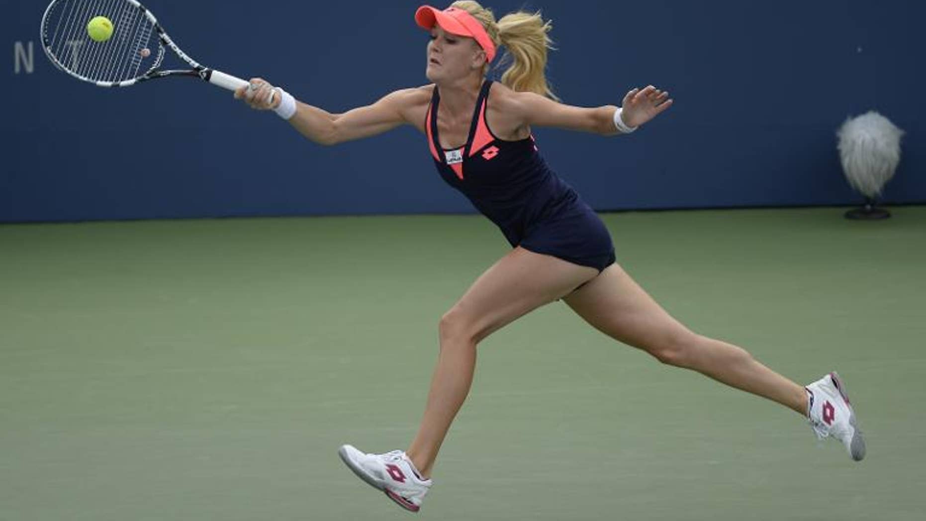 Agnieszka Radwanska of Poland returns the ball against Anastasia Pavlyuchenkova Russia during their 2013 US Open women's singles match on August 30, 2013