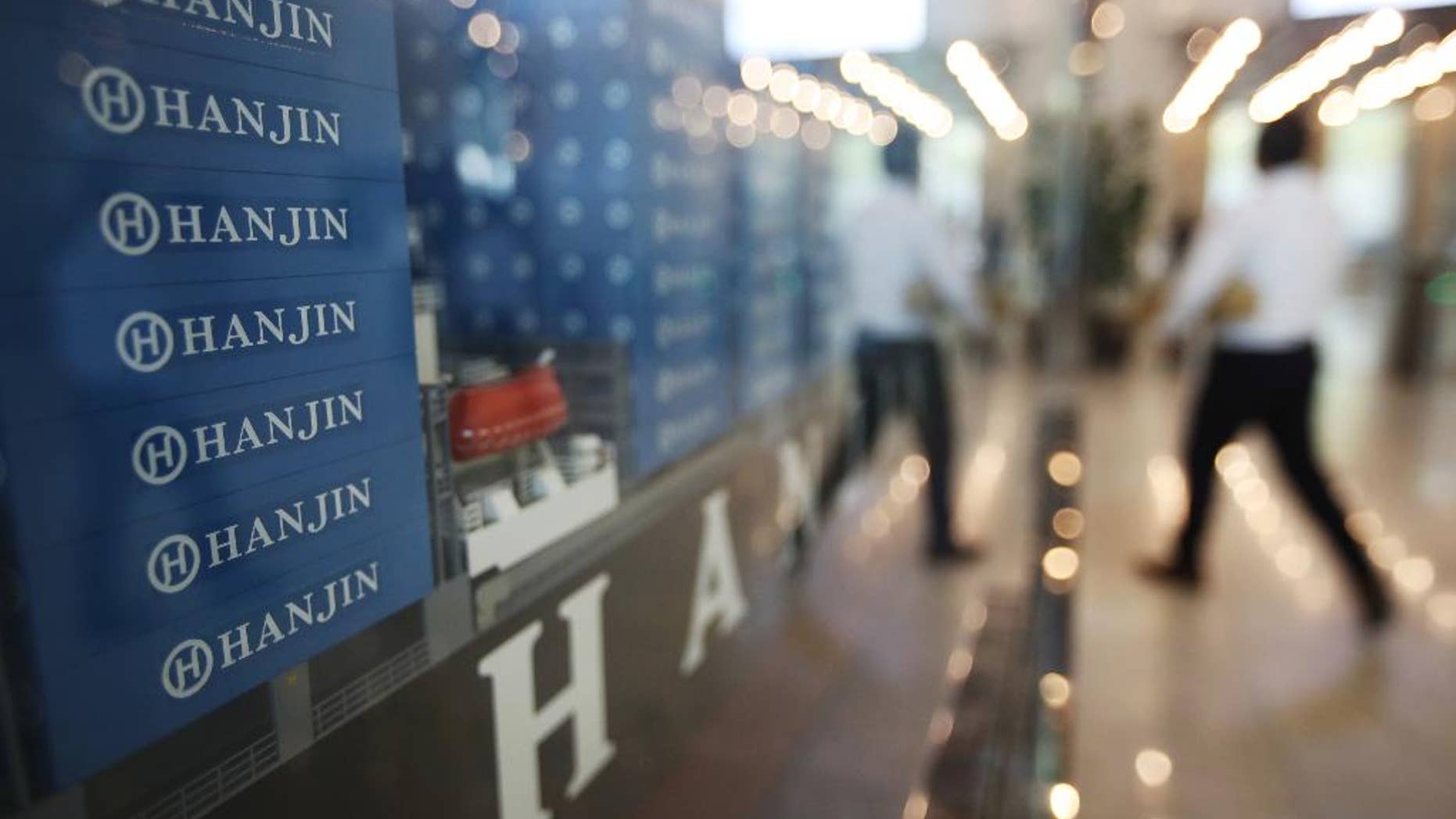 A model of container ship with Hanjin Shipping Co.'s logos is displayed at its head office in Seoul, South Korea, Thursday, Sept. 22, 2016. Hanjin Shipping is to receive as much as $100 million in additional funds to resolve the cargo crisis caused by its slide toward bankruptcy. (Park Dong-ju/Yonhap via AP) KOREA OUT