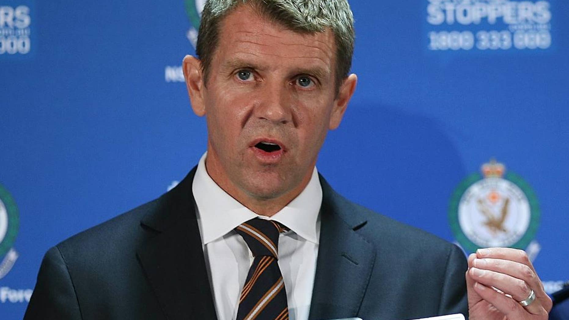 FILE - In this Dec. 16, 2015 file photo, New South Wales Premier Mike Baird speaks to the media during a press conference after a Lindt cafe siege at Martin Place in the central business district of Sydney, Australia. The leader of Australia's most populous state resigned Thursday, Jan. 19, 2017, after his popularity plummeted over a series of decisions during 2016. Baird used social media to announce that the ruling Liberal Party would elect a new leader at a meeting on Tuesday. (AP Photo/Rob Griffith, File)