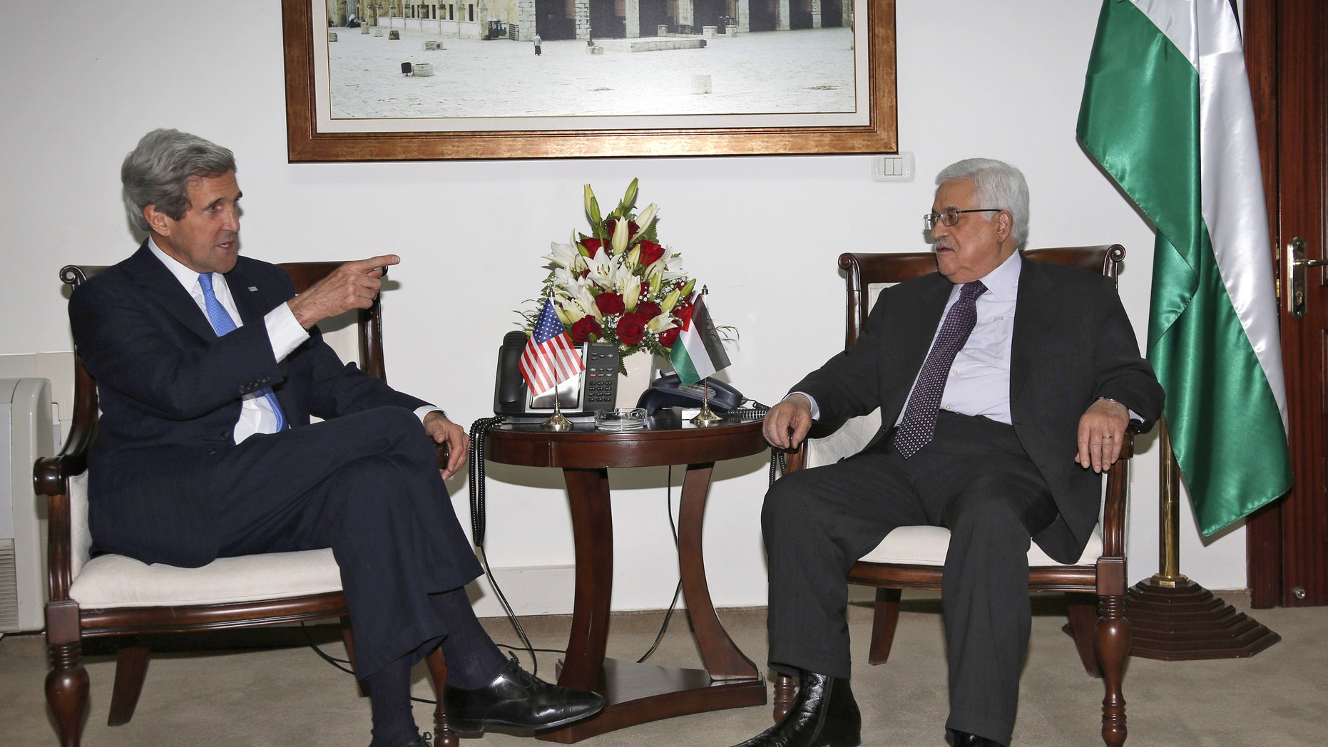 Palestinian President Mahmoud Abbas, right, meets with U.S. Secretary of State John Kerry in the West Bank city of Ramallah, Sunday April 7, 2013. (AP Photo / Mohamed Torokman)