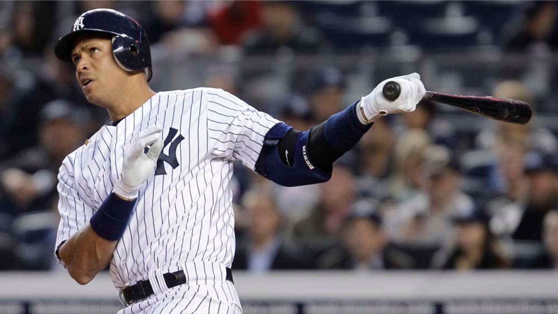 New York Yankees' Alex Rodriguez watches a home run sail off of his bat.