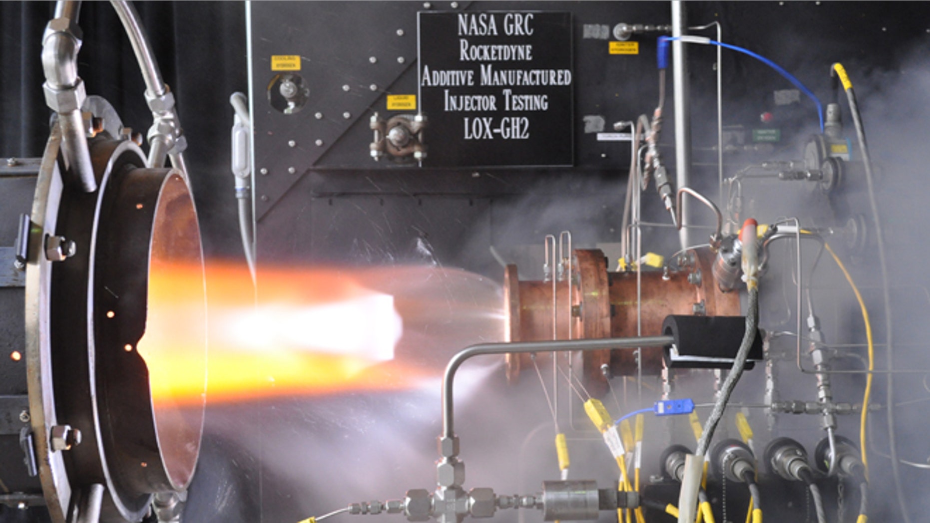 Liquid oxygen/gaseous hydrogen rocket injector assembly built using additive manufacturing technology is hot-fire tested at NASA Glenn Research Centers Rocket Combustion Laboratory in Cleveland.