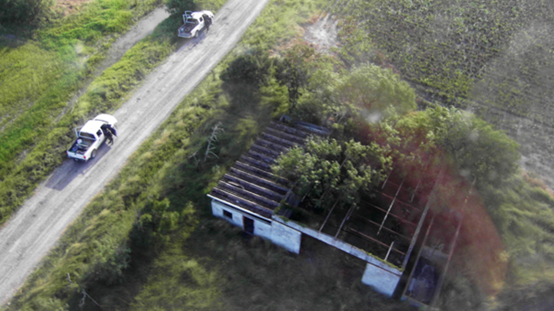 Aug. 24: This image released by Mexico's Navy shows the alleged site where the bodies of 72 South American migrants were found.