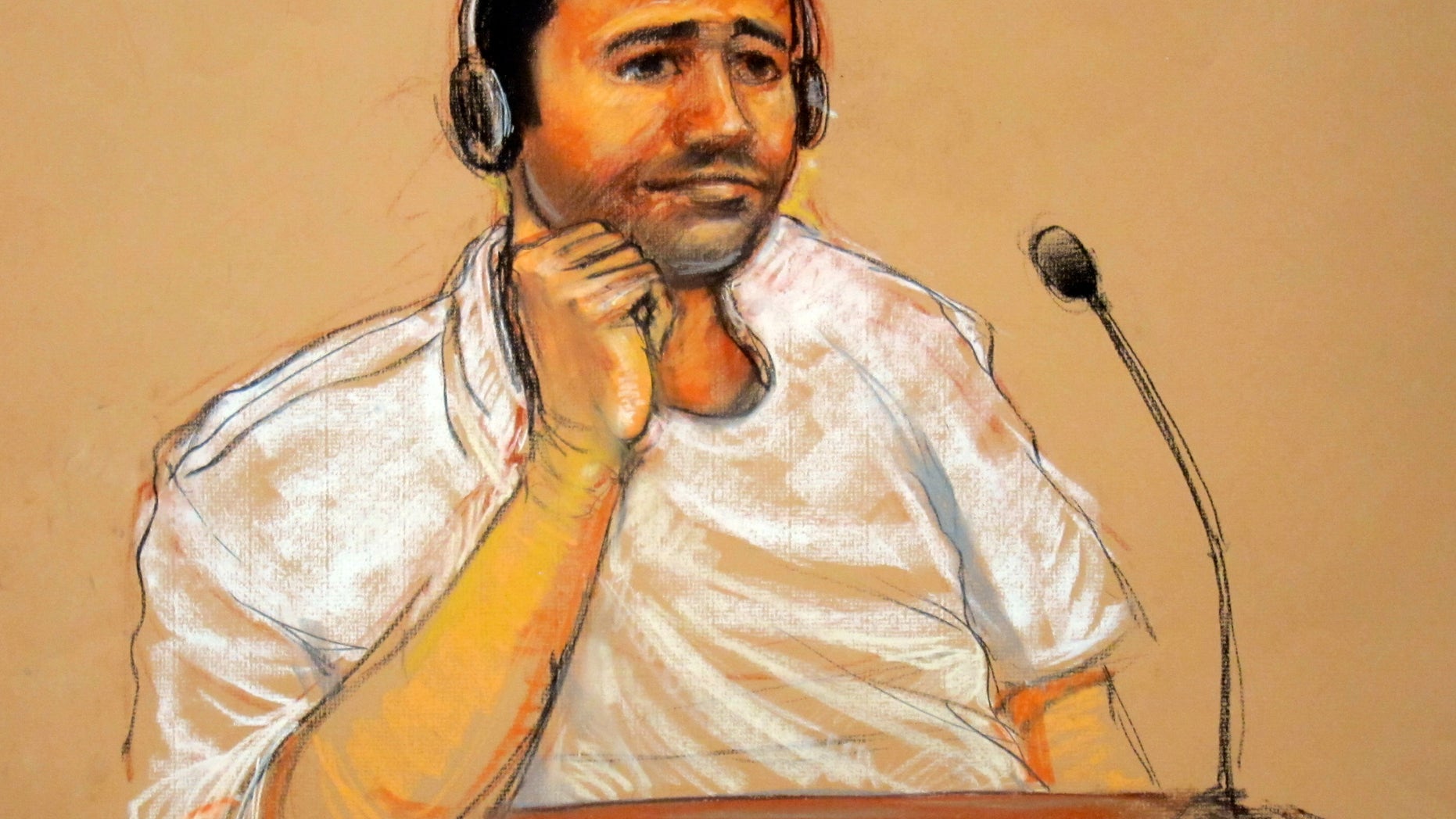In this sketch by courtroom artist Janet Hamlin, taken Nov. 9, 2011, reviewed by the U.S. military, Abd al-Rahim al-Nashiri is seen during his military commissions arraignment at the Guantanamo Bay detention center in Guantanamo, Cuba. A judge at Guantanamo Bay refused Monday to suspend a pretrial hearing for Abd al-Rahim al-Nashiri, the prisoner accused of orchestrating the attack on the USS Cole, ruling that defense lawyers had offered no evidence supporting their suspicion that the CIA can eavesdrop on their private conversations with their client. (AP Photo/Janet Hamlin, Pool)