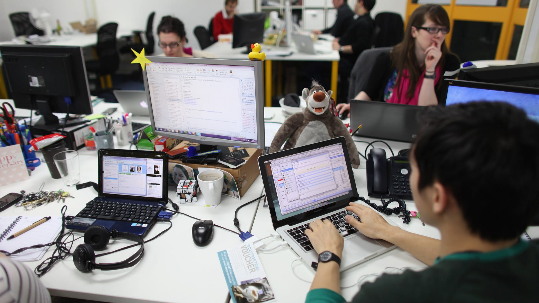 LONDON, ENGLAND - MARCH 15: People work at computers in TechHub, an office space for technology start-up entrepreneurs, near the Old Street roundabout in Shoreditch which has been dubbed 'Silicon Roundabout' due to the number of technology companies operating from the area on March 15, 2011 in London, England. Entrepreneurs using TechHub are predominantly product-oriented tech companies who rent desk space and use the fast wifi. The relatively low rental rates and proximity to media and internet companies has made the area close to the roundabout a prime location for IT firms and web entrepreneurs. (Photo by Oli Scarff/Getty Images)