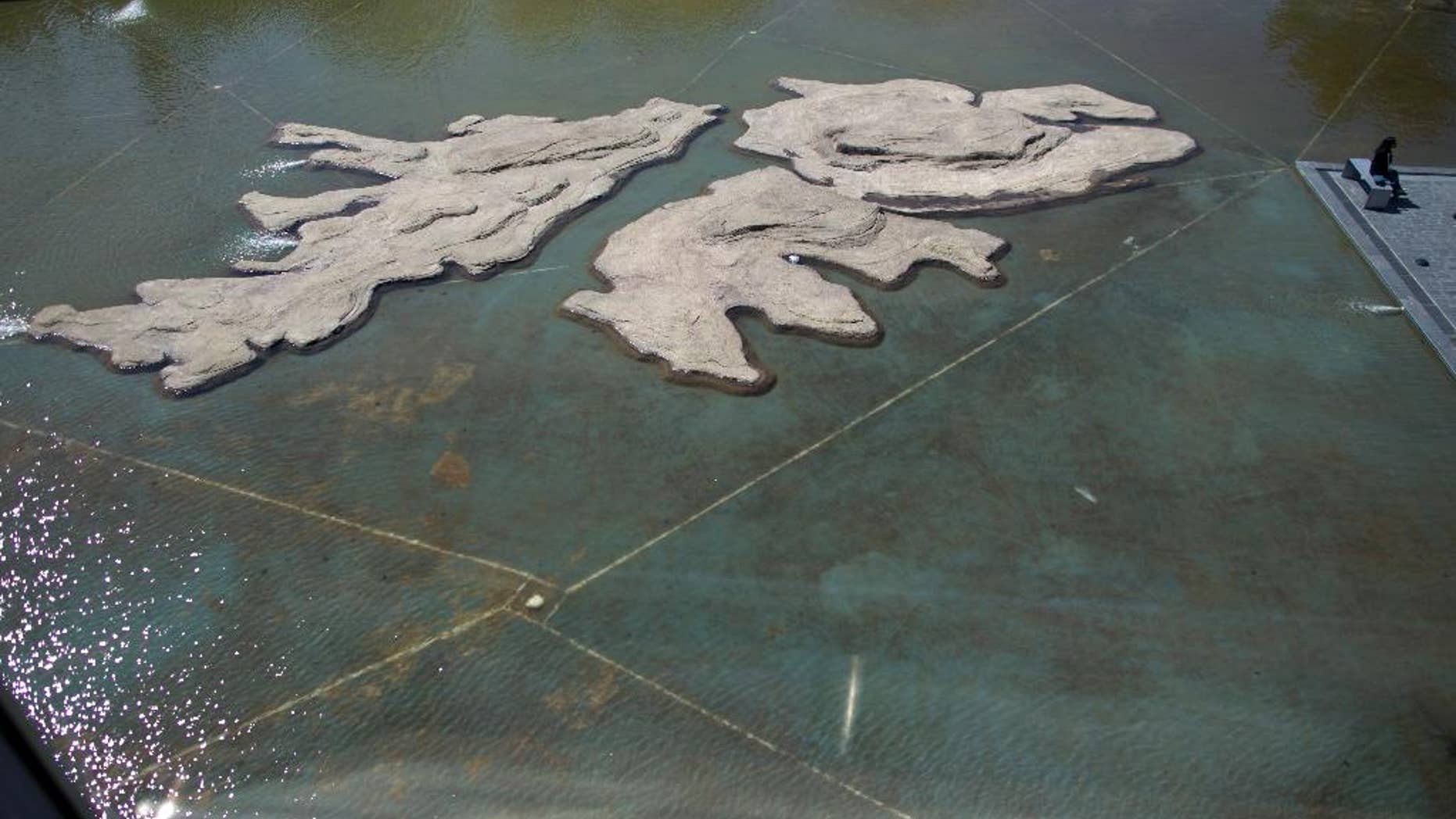 FILE - In this Sept. 18, 2015 file photo, the Malvinas Museum features rocks in the shape of Malvinas, or Falkland Islands, in Buenos Aires, Argentina. Argentina’s government celebrated on Monday, March 28, 2016 a decision by a U.N. commission expanding its maritime territory in the South Atlantic Ocean to include the disputed islands and beyond. The Argentine foreign ministry said the decision will be key in its dispute with Britain over the Islands. Argentina lost the 1982 war with Britain after Argentine troops seized the South Atlantic archipelago. (AP Photo/Natacha Pisarenko, File)