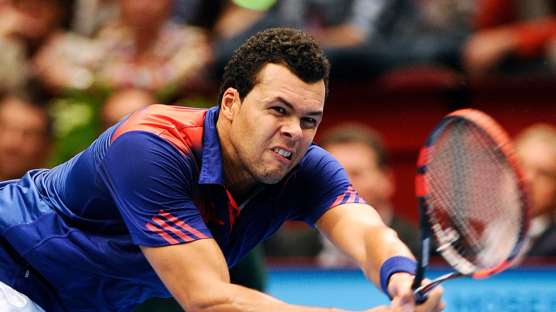 Jo-Wilfried Tsonga of France returns the ball to Robin Haase of the Netherlands during their semi final match at the Erste Bank Open tennis tournament in Vienna, Austria, Saturday, Oct. 19, 2013. (AP Photo/Hans Punz)