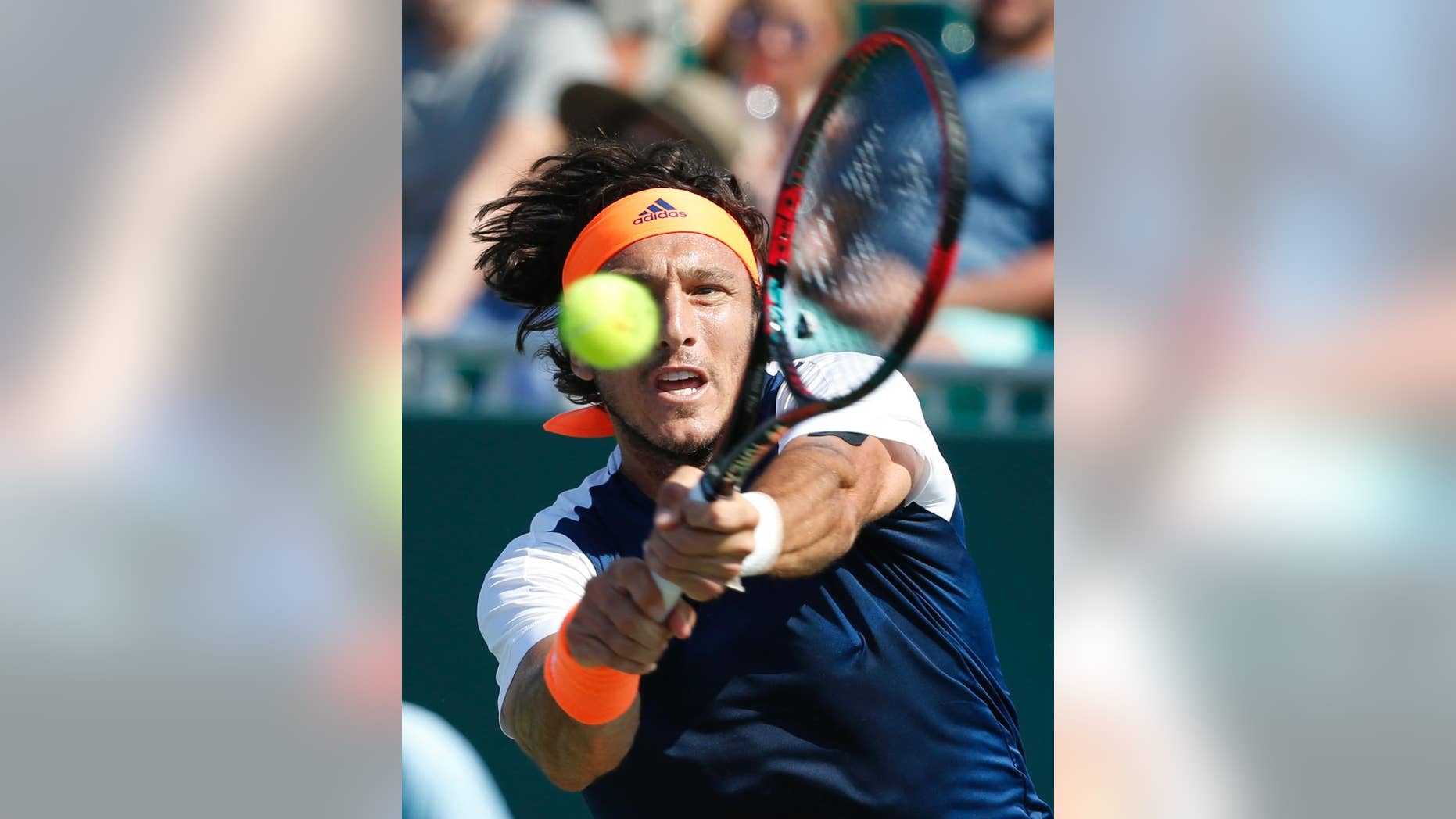 File.- In this March 22, 2017 file photo Juan Monaco returns a shot from Federico Delbonis, both of Argentina, during a tennis match at the Miami Open in Key Biscayne, Fla. Monaco, 33, announced Monday May 15 his retirement from competition.(AP Photo/Wilfredo Lee, File)