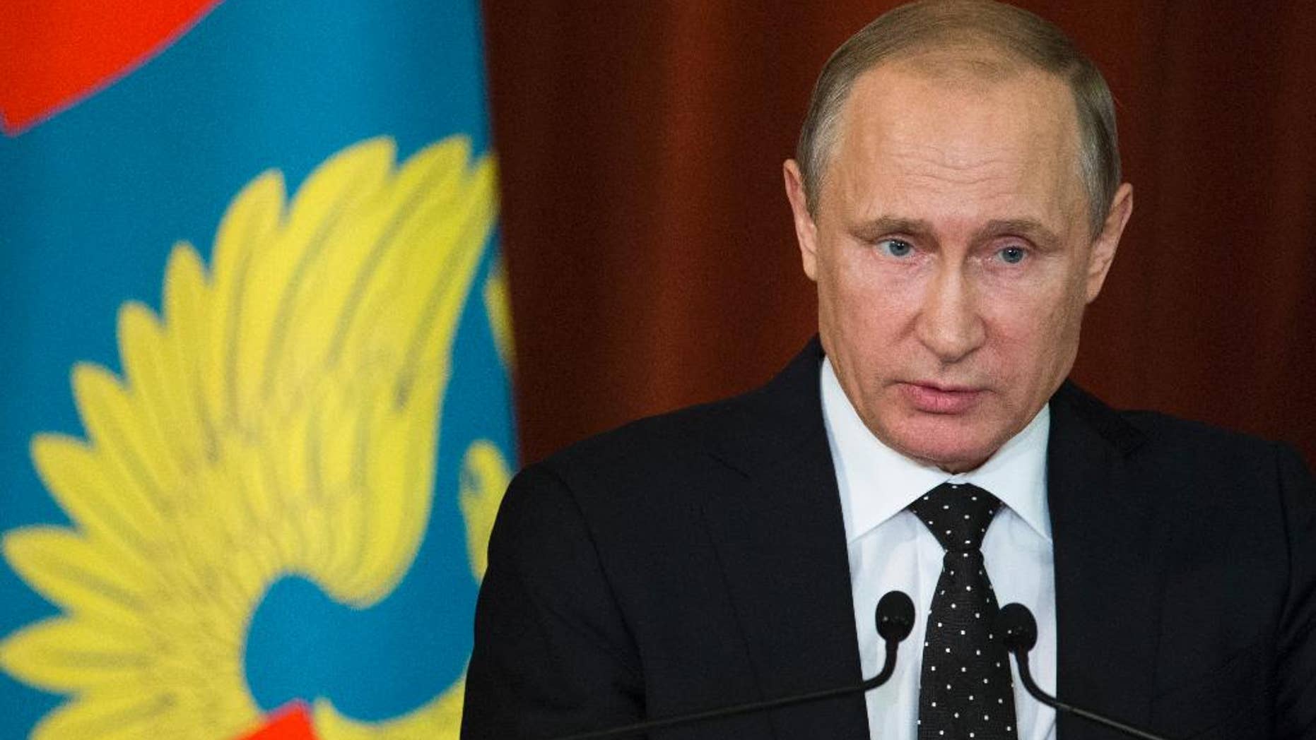 Russian President Vladimir Putin speaks during his meeting with Russian Ambassadors in Moscow, Russia, Thursday, June 30, 2016. Putin said that Russia will respond to NATO's military buildup near its borders, but will not be drawn into an arms race. (AP Photo/Ivan Sekretarev, pool)
