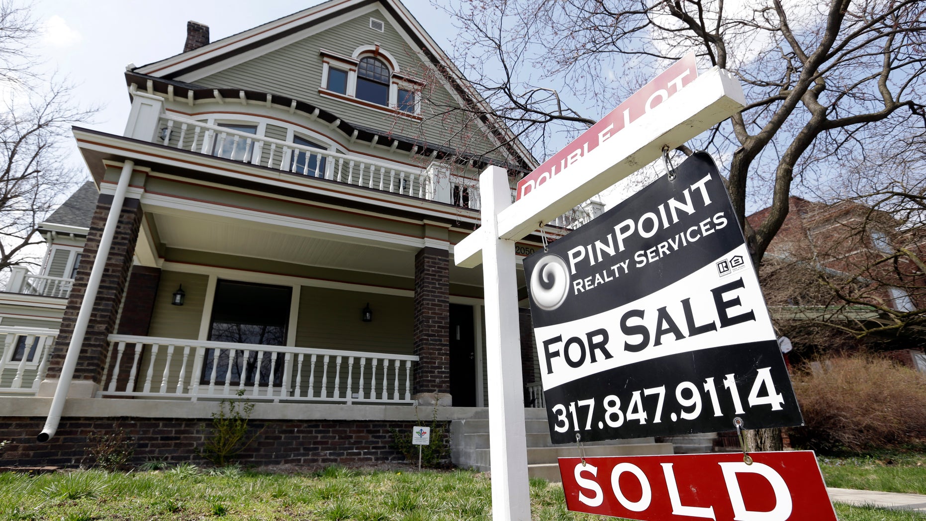 In this Tuesday, April 9, 2013, photo, a "Sold" sign is posted outside a home in Indianapolis. Freddie Mac reports on mortgage rates for this week on Thursday, May 2, 2013. The average on the 30-year fixed mortgage fell last week to 3.40 percent. . (AP Photo/Michael Conroy)
