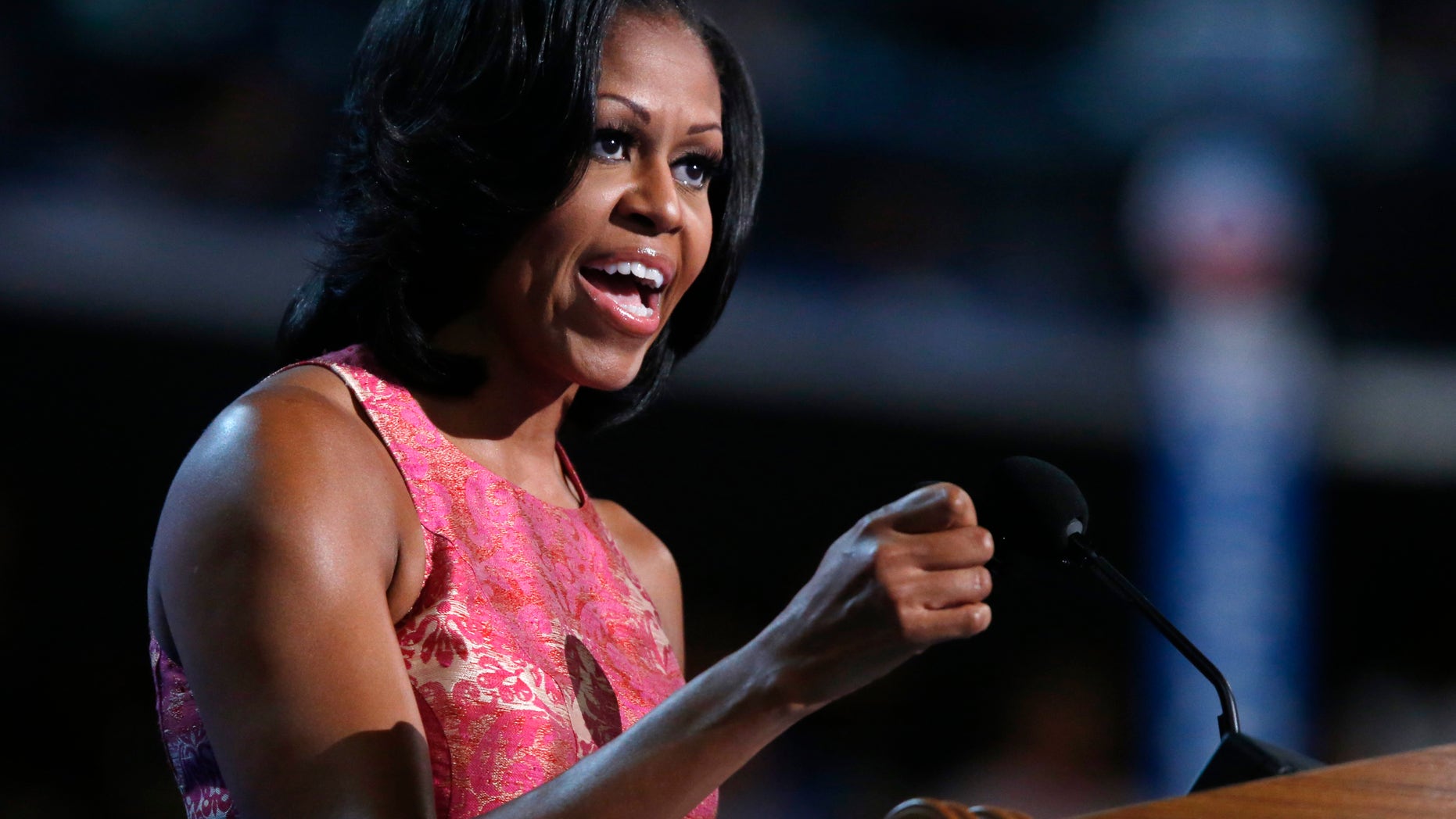 First lady Michelle Obama addresses the Democratic National Convention in Charlotte, N.C., on Tuesday, Sept. 4, 2012. (AP Photo/Jae C. Hong)