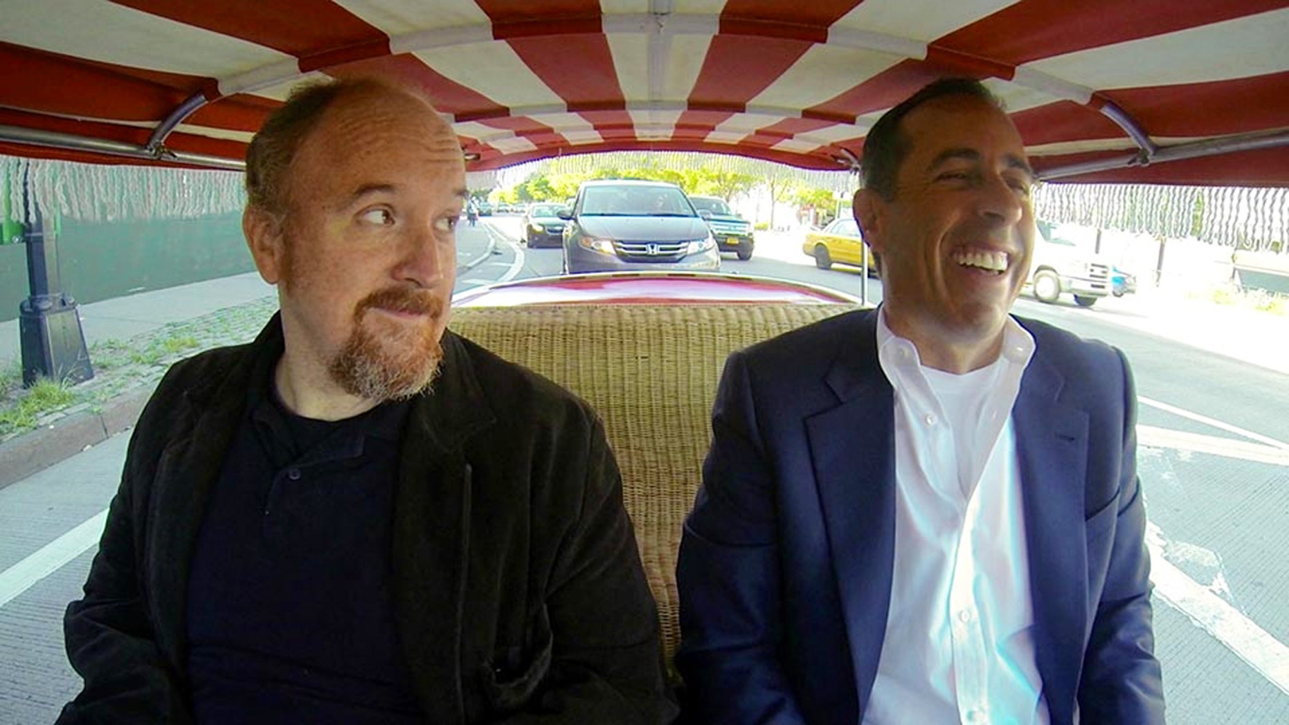 This image released by Crackle shows comedians Louis C.K., left, and Jerry Seinfeld in a scene from Seinfeld's new web series talk show "Comedians in Cars Getting Coffee." The series launched on the Crackle digital network in 2012, and its third season cranks up Thursday, Jan. 2, with Seinfeld joining Louis C.K. for a cup of joe after a zany ride on a clown-car-scale 1959 Fiat Jolly. (AP Photo/Crackle)