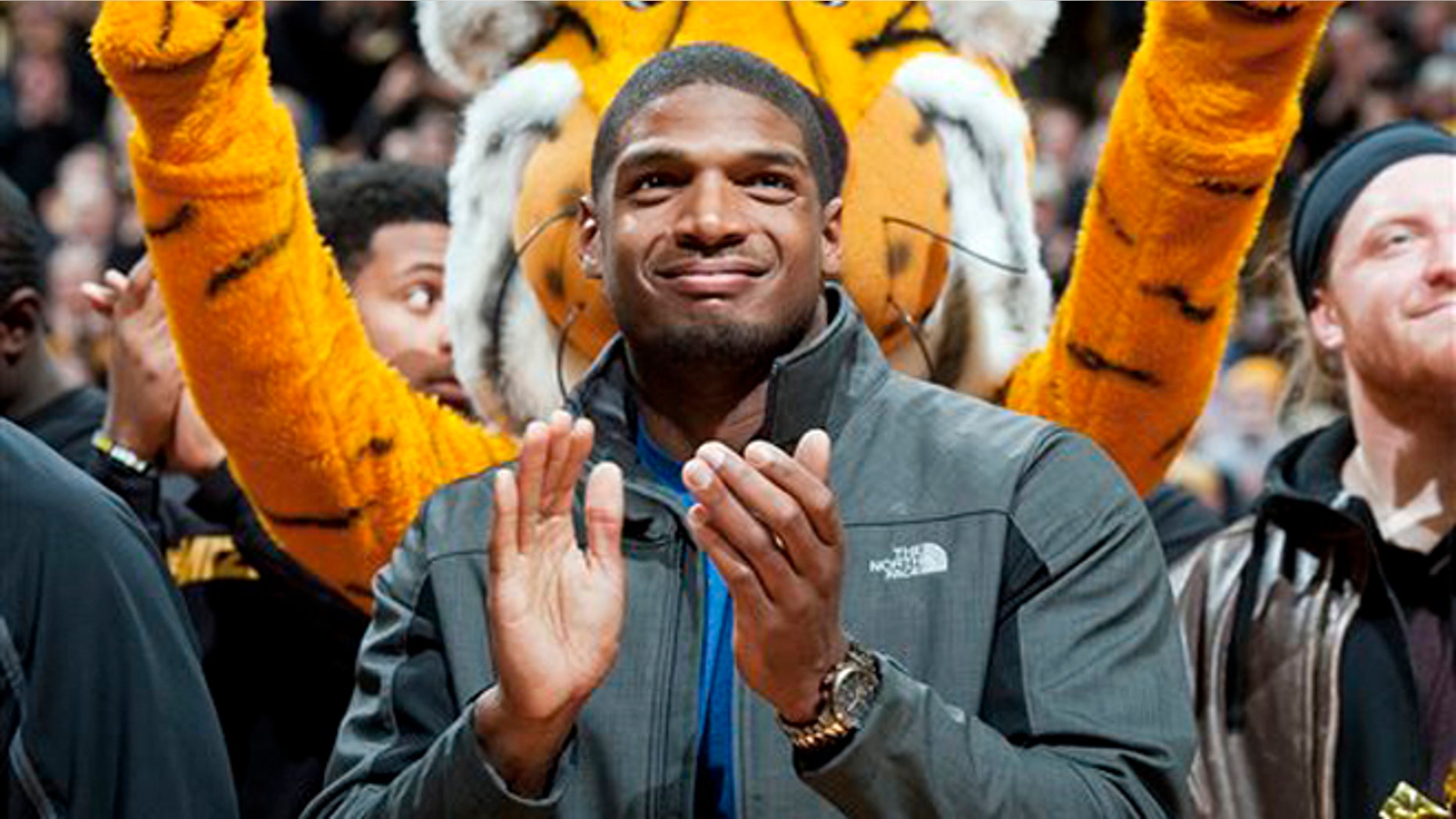 Michael Sam at halftime of an NCAA college basketball game on Feb. 15, 2014.