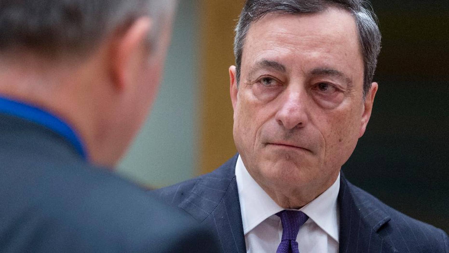 President of the European Central Bank Mario Draghi arrives prior to a round table meeting of Eurogroup finance ministers at the EU Council building in Brussels on Monday, Feb. 20, 2017. The eurozone's 19 finance ministers will be looking to defuse the risk of another Greek crisis as they try to agree Monday on what reforms Greece must still take to qualify for more loans. (AP Photo/Thierry Monasse)