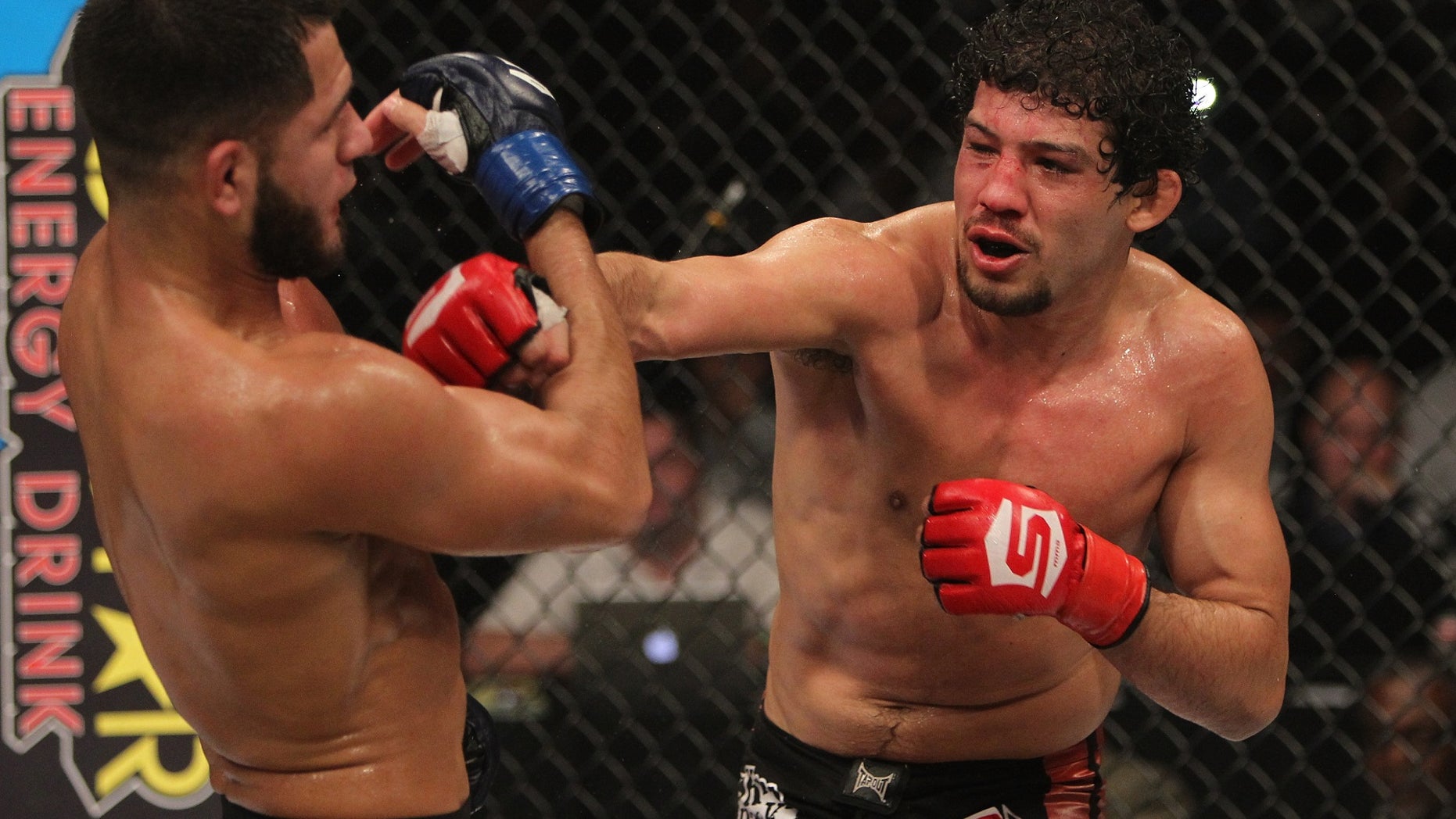 Gilbert Melendez punches Jorge Masvidal during the Strikeforce event at the Valley View Casino Center on December 17, 2011 in San Diego, California.
