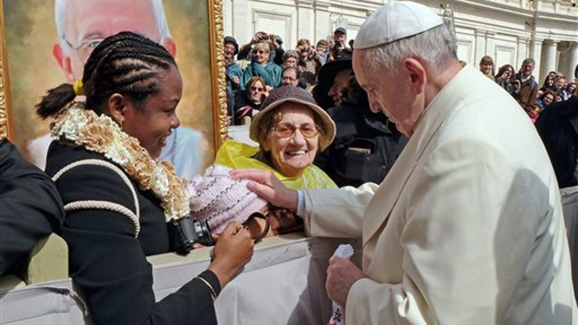 Pope Francis touches 10-year-old Jersey Vargas on March 26, 2014.