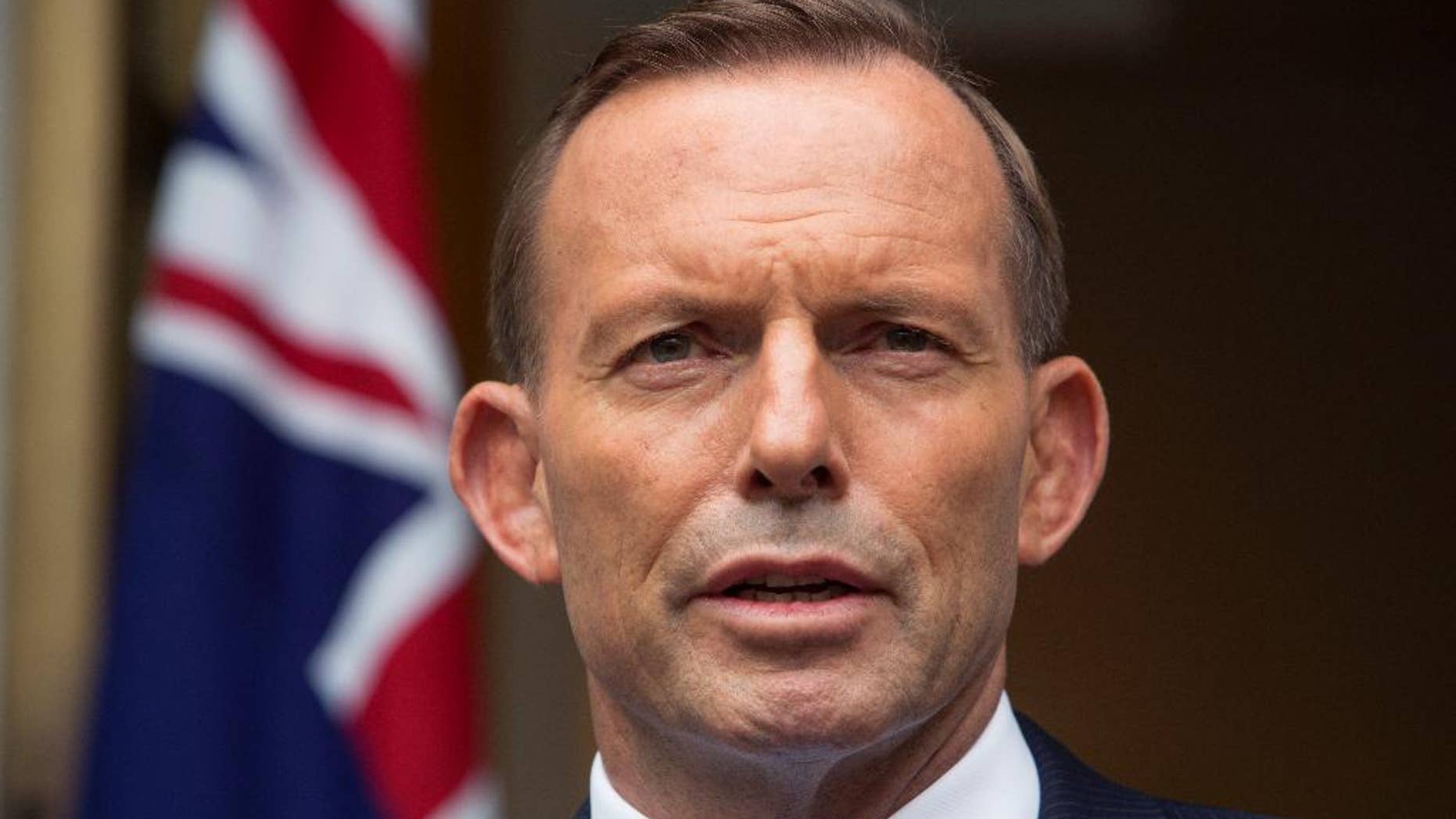 FILE - In this Feb. 9,. 2015 file photo, Australian Prime Minister Tony Abbott answers questions at a media conference before attending the parliament's question time in Canberra. Australia's gaffe-prone prime minister took back his second Nazi-related comment in a month on Thursday, March 19 after he compared the opposition party leader to German World War II-era propaganda minister Joseph Goebbels. (AP Photo/Andrew Taylor, File)